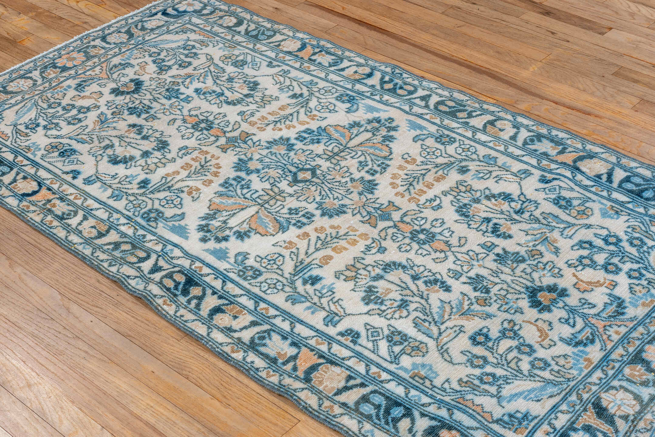 3' x 6' one-of-a-kind handmade vintage Lilian small size rug. Color palette: ivory, sky blue, teal, camel, navy, taupe