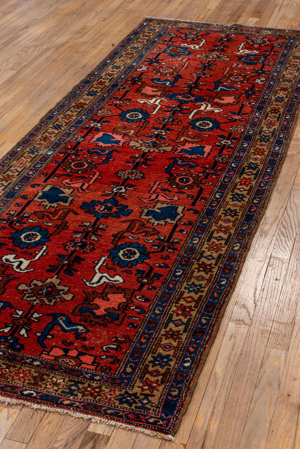 3' x 9' one-of-a-kind handmade vintage Malayer runner rug. Color palette: terra cotta, ivory, navy, blue, rose, brown