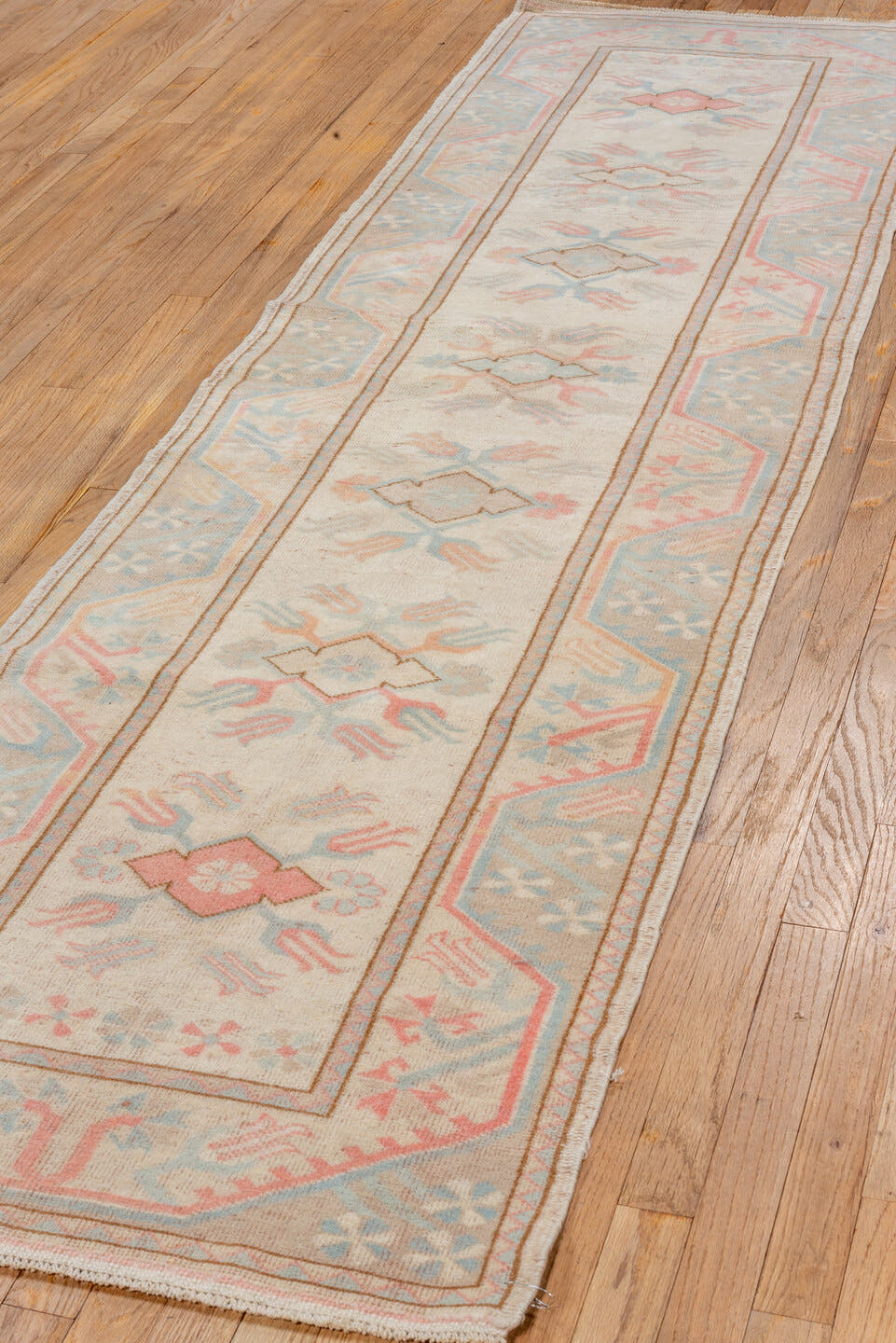 2' x 9' one-of-a-kind handmade vintage Oushak runner rug. Color palette: ivory, pale blue, blush, taupe, cream, peach
