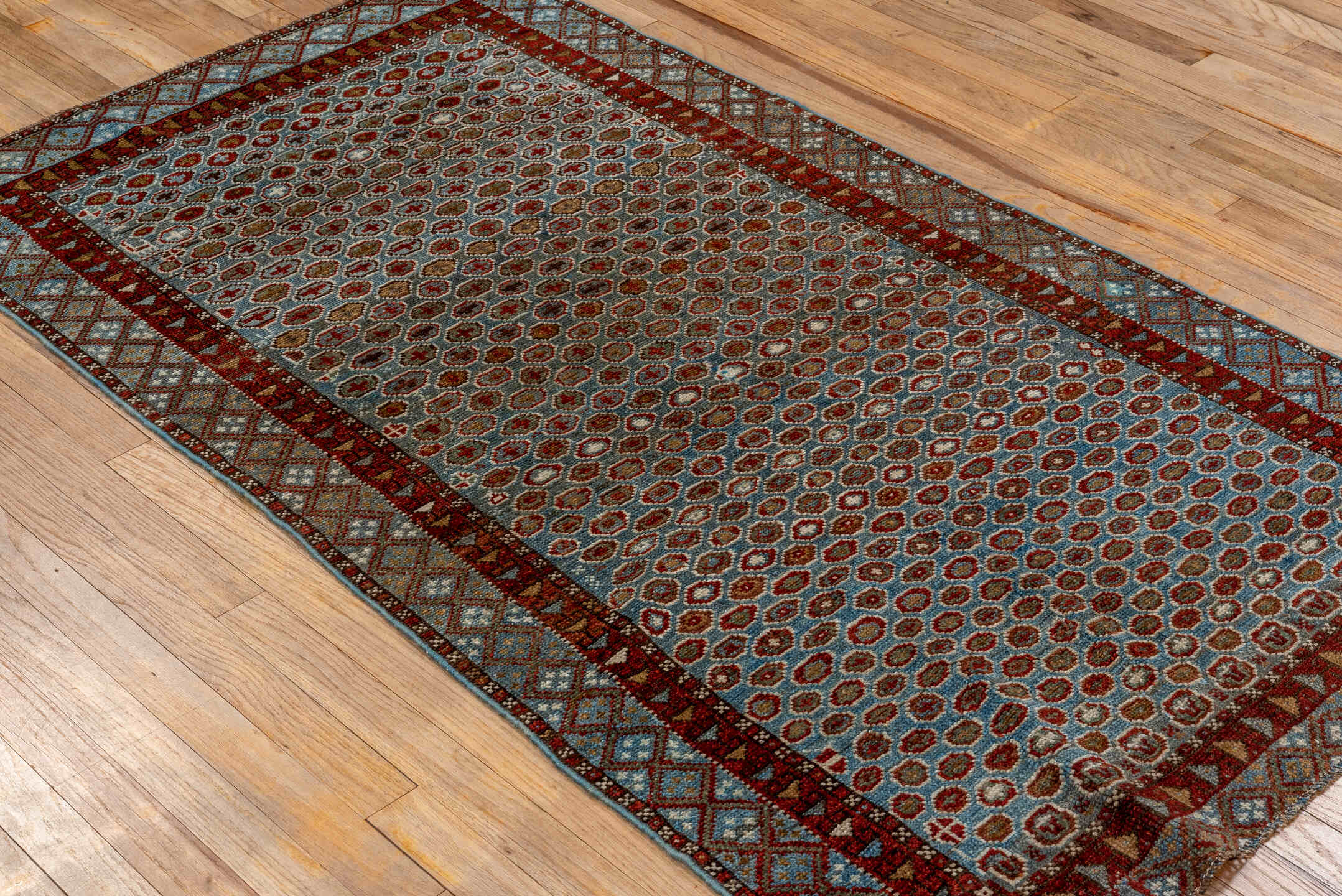 3' x 6' one-of-a-kind handmade vintage Malayer small size rug. Color palette: light blue, rust, ivory, brown, brick red