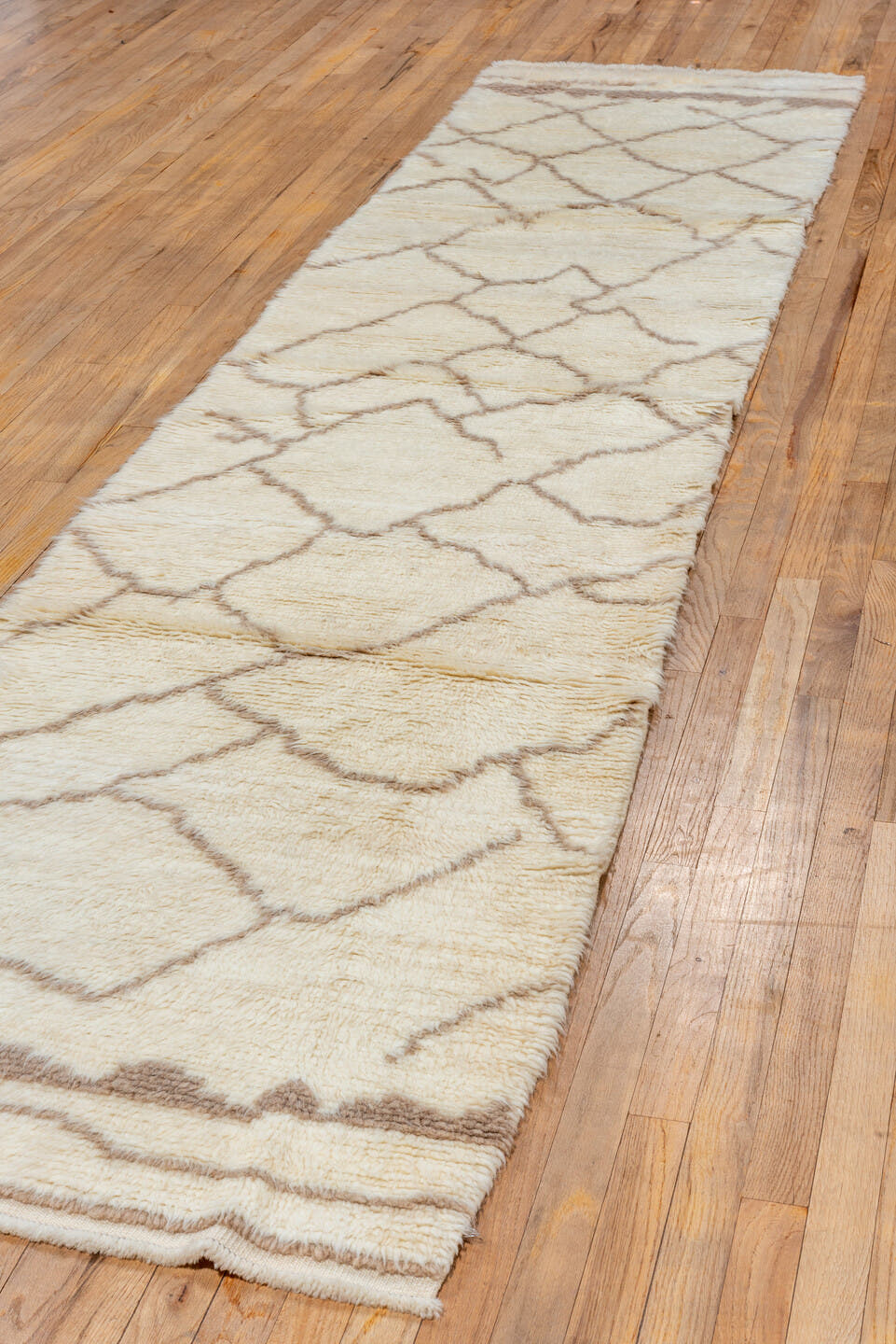 2' x 12' one-of-a-kind handmade vintage Moroccan runner rug. Color palette: ivory, taupe, cream, camel, beige, gray