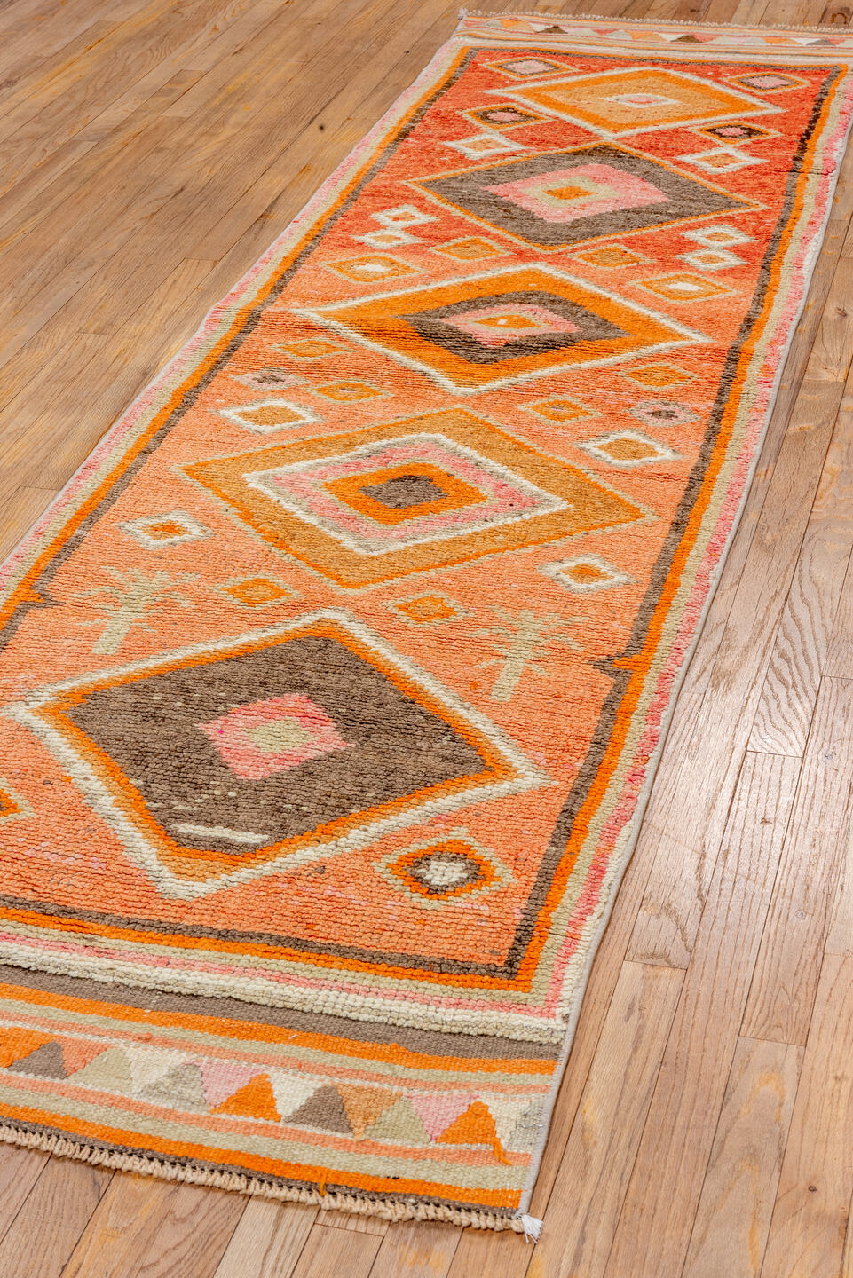 2' x 10' one-of-a-kind handmade vintage Oushak runner rug. Color palette: brown, light gray, off-white, orange, pink, red