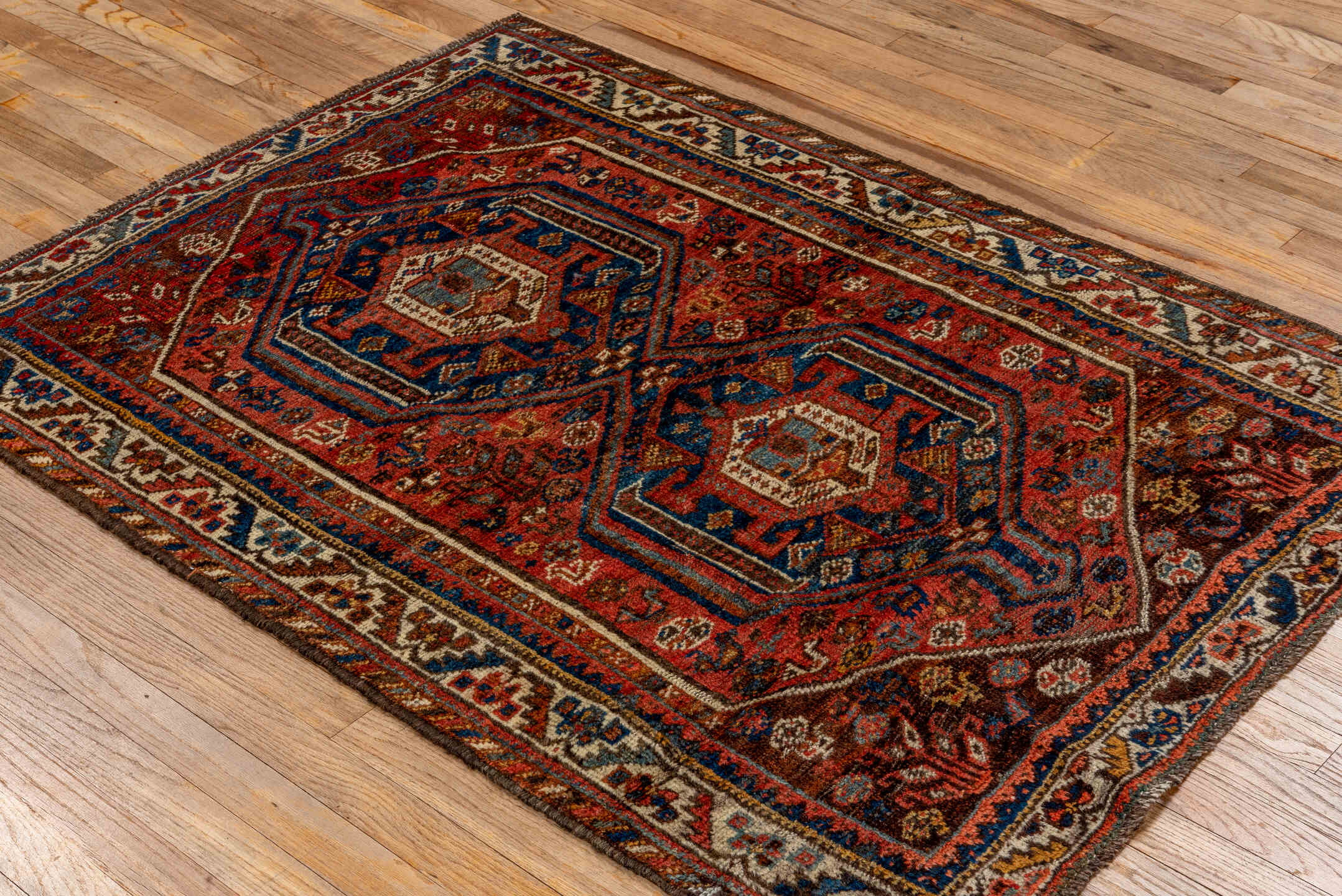 3' x 4' one-of-a-kind handmade vintage Shiraz small size rug. Color palette: rust, ivory, navy, brown, sky_blue, coral