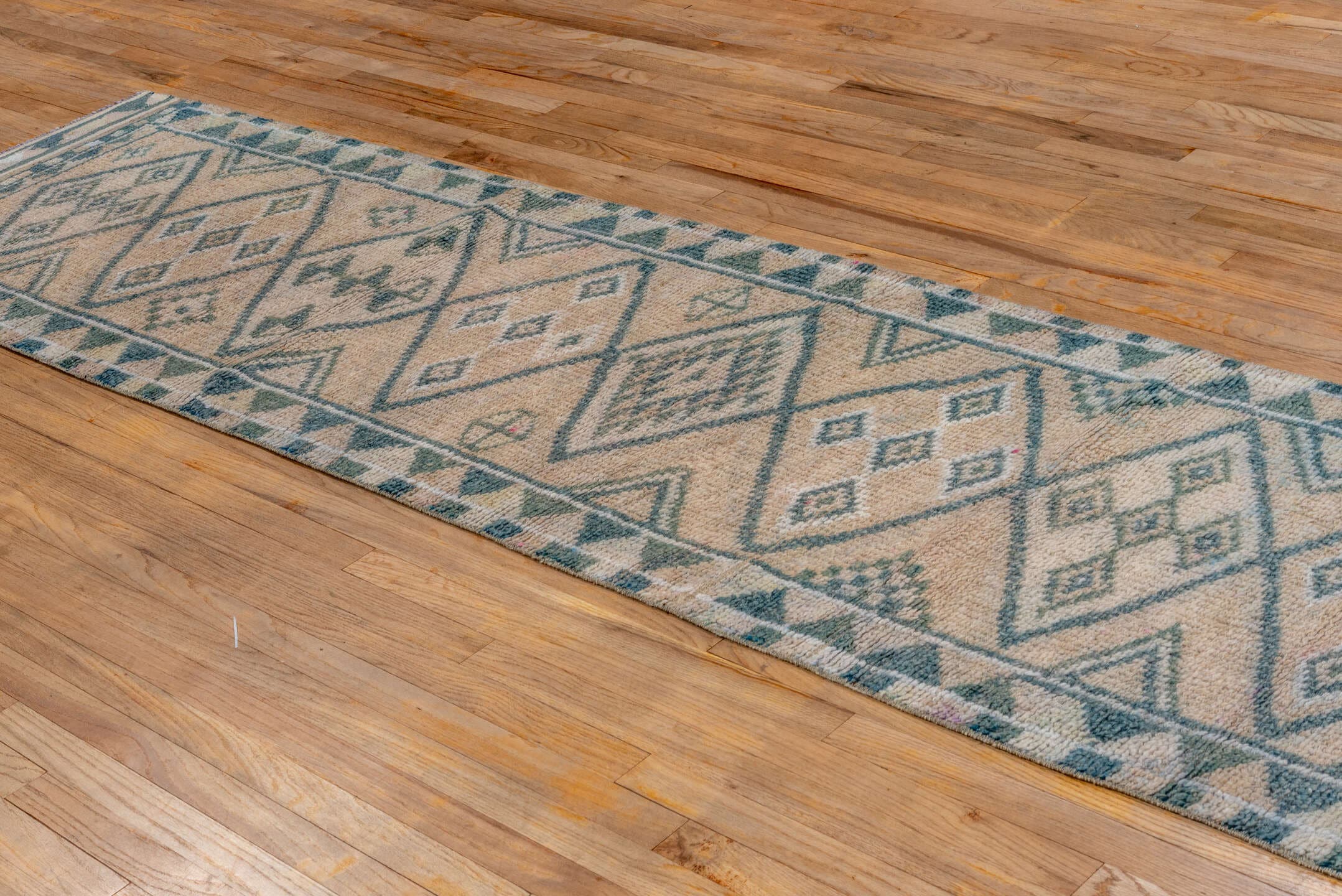 2' x 12' one-of-a-kind handmade vintage Oushak runner rug. Color palette: ivory, sky blue, slate, taupe, light blue, gray