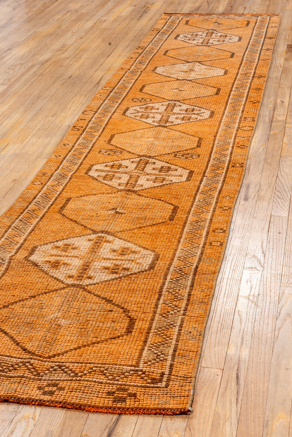 2' x 12' one-of-a-kind handmade vintage Oushak runner rug. Color palette: brown, off-white, orange, pink, snow, white