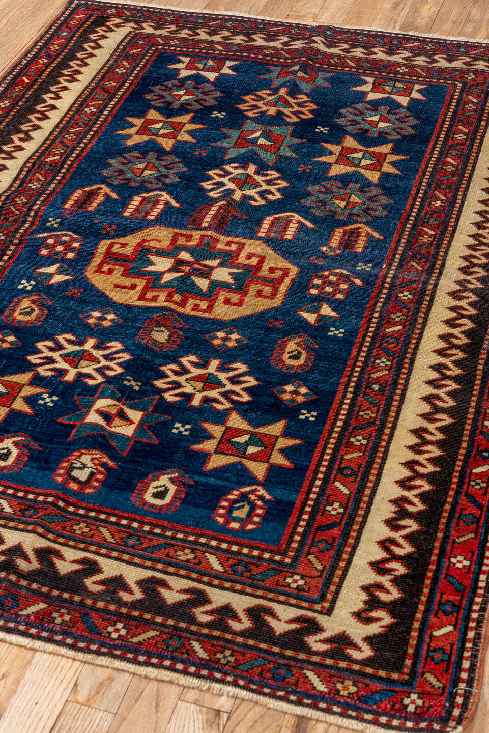 3' x 4' one-of-a-kind handmade vintage Shirvan small size rug. Color palette: blue, ivory, rust, brown, crimson, teal, camel