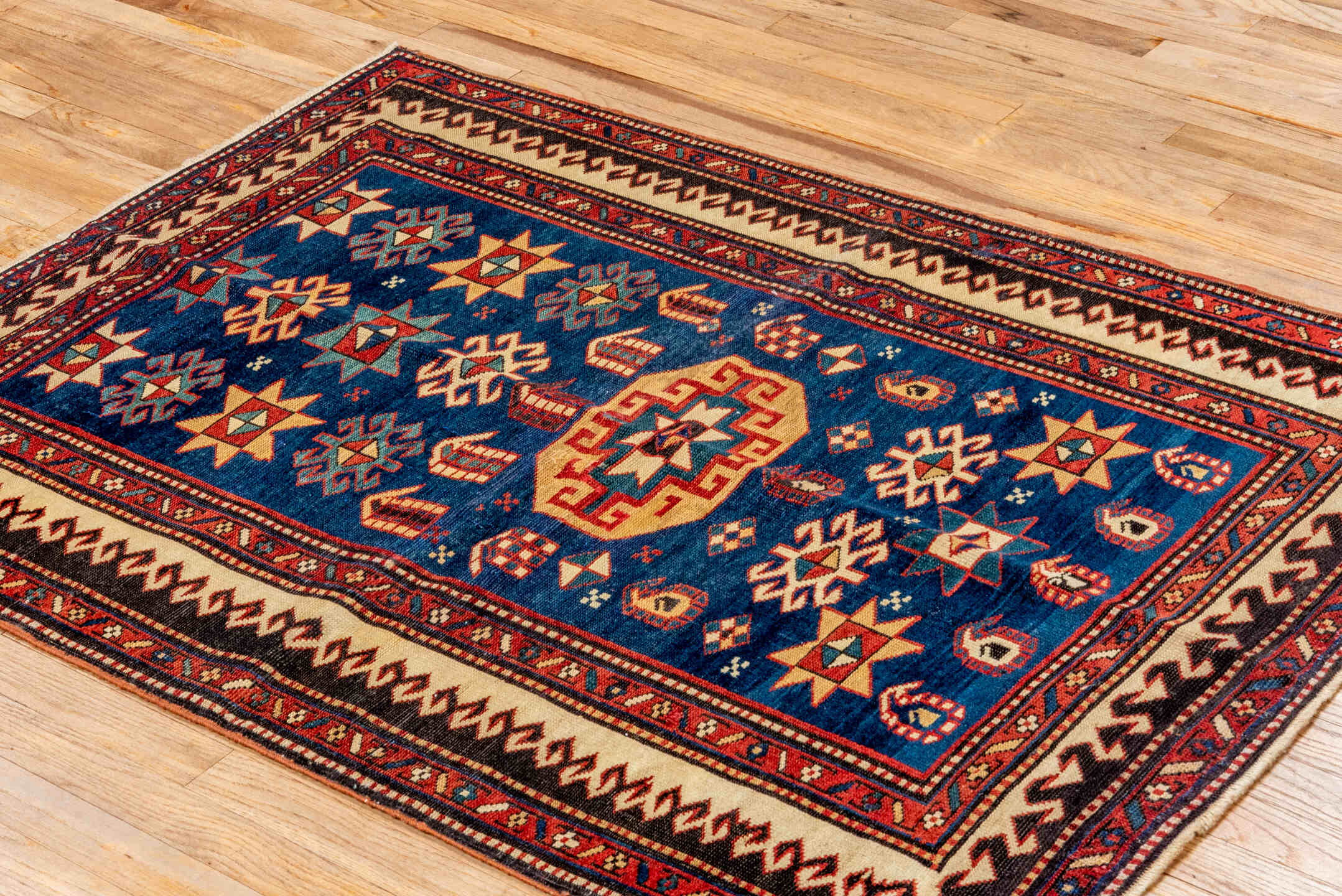 3' x 4' one-of-a-kind handmade vintage Shirvan small size rug. Color palette: blue, ivory, rust, brown, crimson, teal, camel
