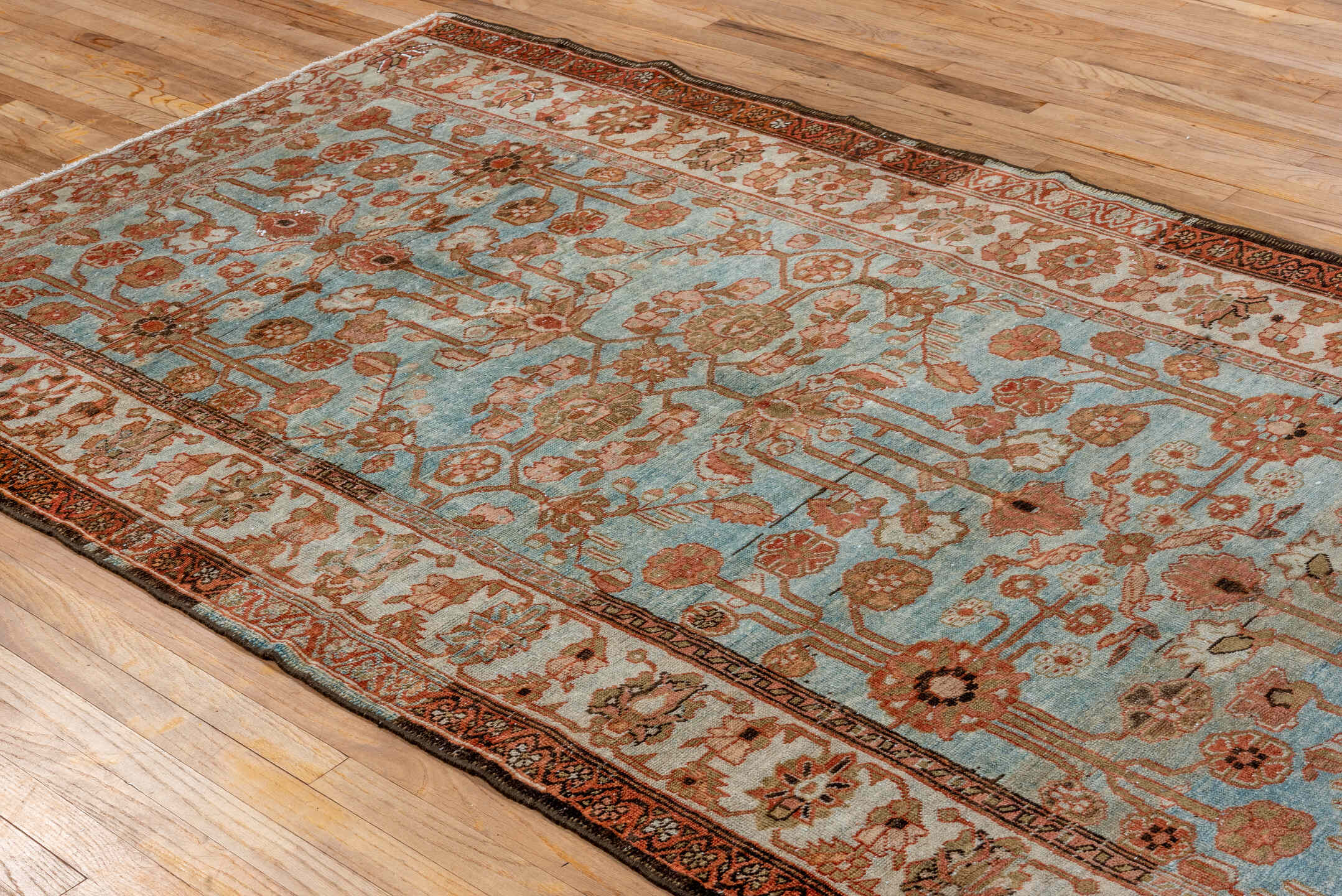 5' x 9' one-of-a-kind handmade vintage Lilian medium size rug. Color palette: light blue, ivory, rust, camel, taupe, brown