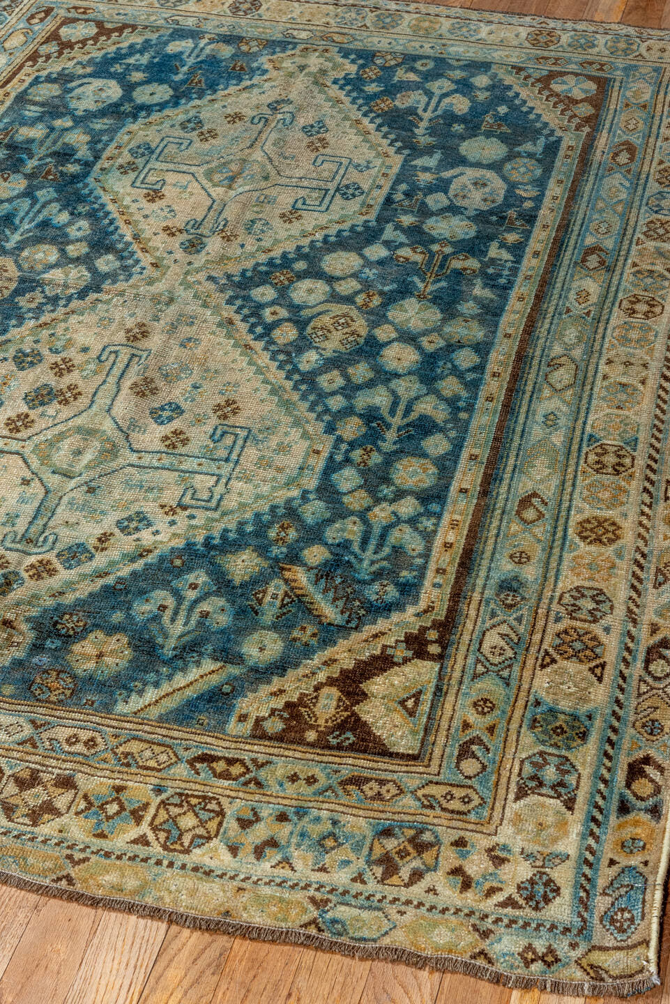 4' x 5' one-of-a-kind handmade vintage Shiraz small size rug. Color palette: blue, ivory, camel, brown, sky blue, taupe