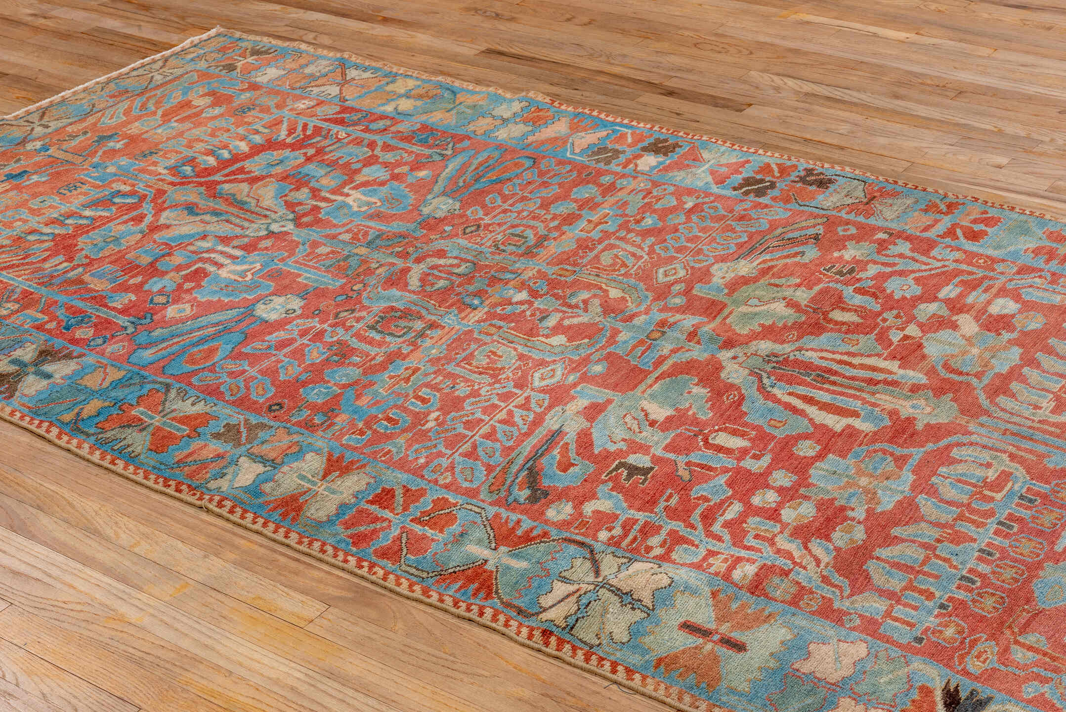 5' x 9' one-of-a-kind handmade vintage Lilian medium size rug. Color palette: coral, sky blue, ivory, taupe, rust, brown