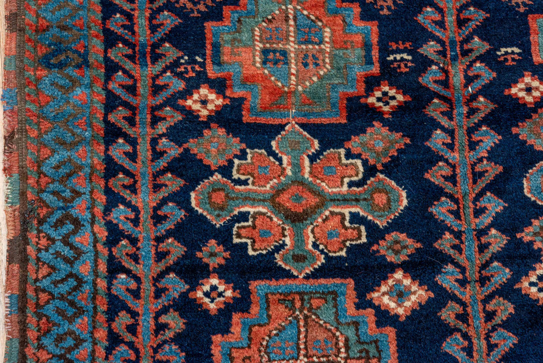4' x 5' one-of-a-kind handmade vintage Kurd small size rug. Color palette: navy, turquoise, rust, ivory, coral, camel, blue