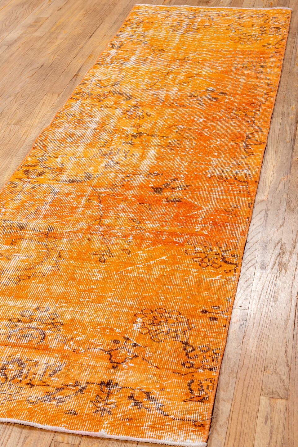 2' x 9' one-of-a-kind handmade vintage Overdyed runner rug. Color palette: orange, apricot, charcoal, ivory, terracotta