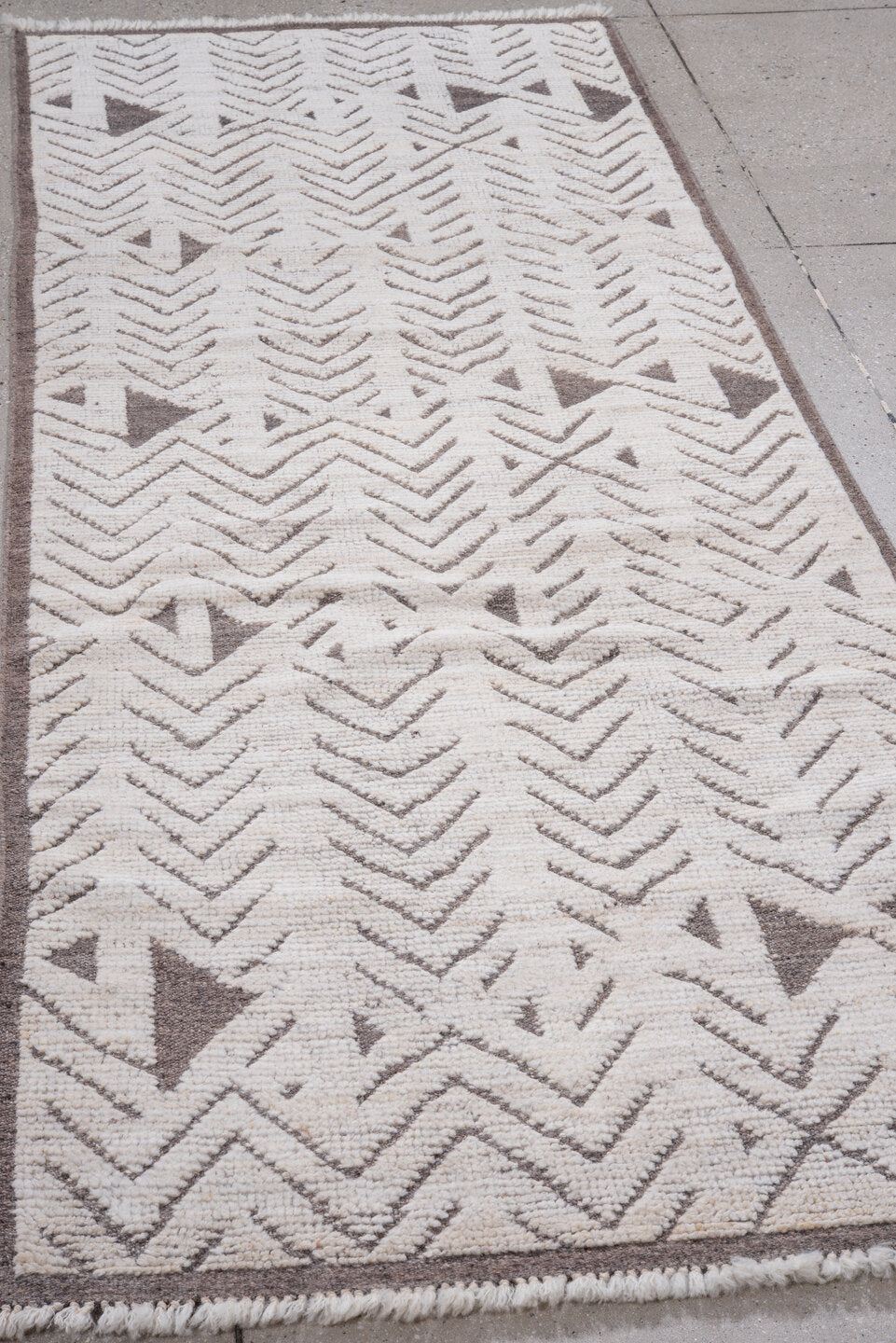 3' x 9' one-of-a-kind handmade vintage Tulu runner rug. Color palette: ivory, taupe, brown, beige, gray