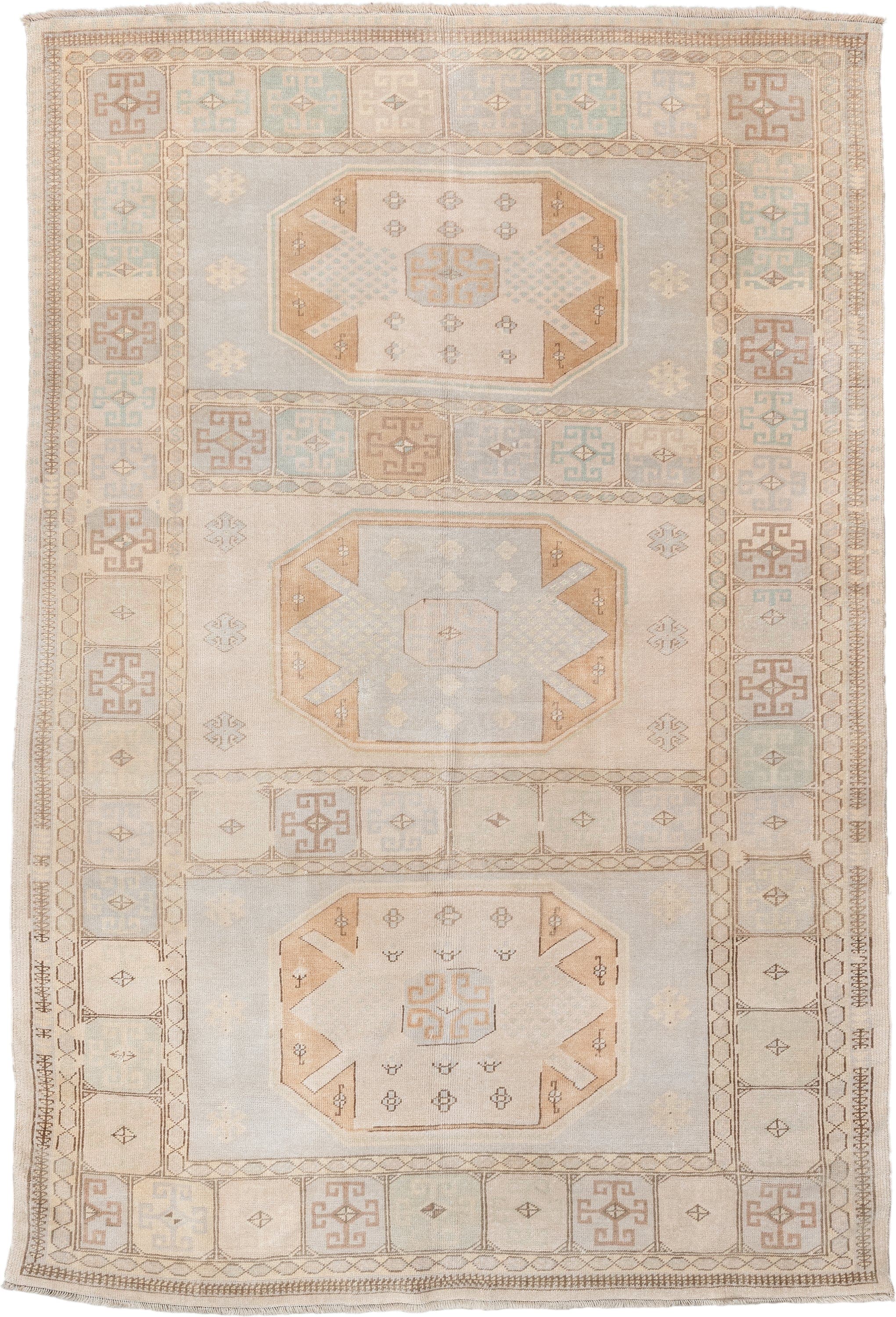 6' x 9' one-of-a-kind handmade vintage medium size rug. Color palette: ivory, pale blue, beige, camel, taupe, light blue