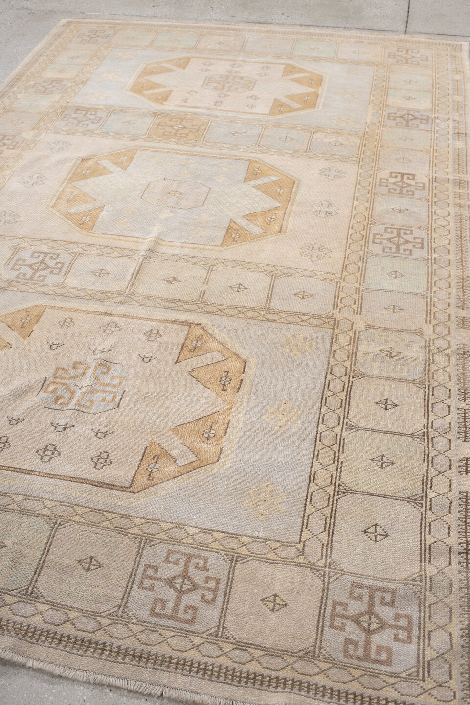 6' x 9' one-of-a-kind handmade vintage  medium size rug. Color palette: ivory, pale blue, beige, camel, taupe, light blue