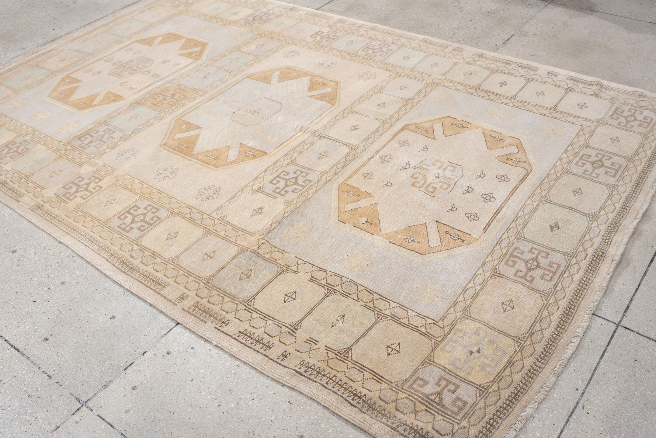 6' x 9' one-of-a-kind handmade vintage medium size rug. Color palette: ivory, pale blue, beige, camel, taupe, light blue