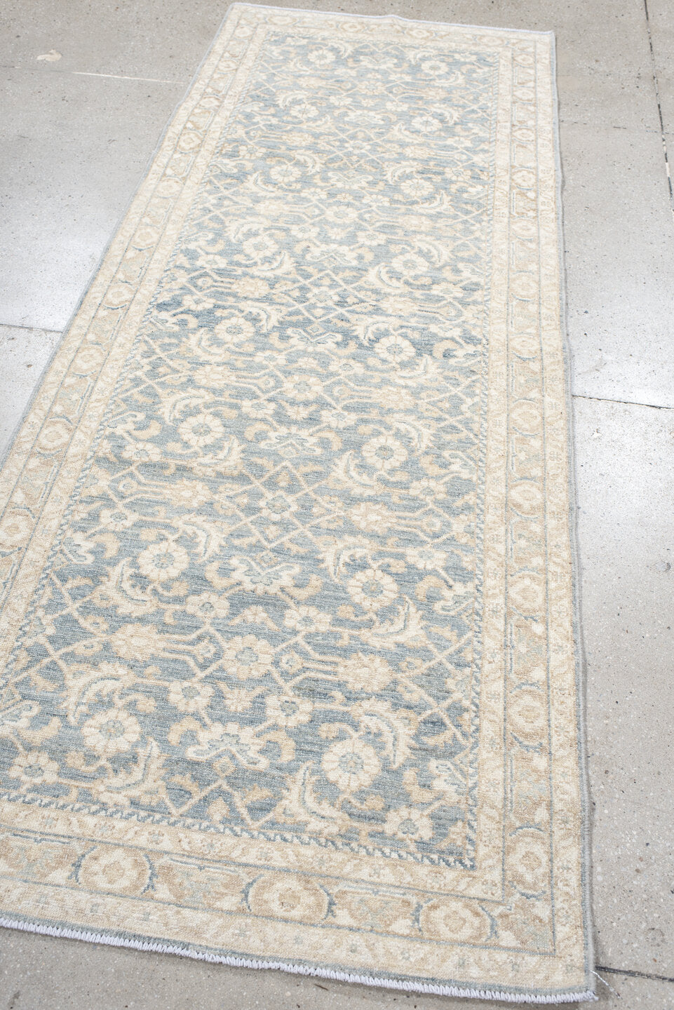 3' x 8' one-of-a-kind handmade vintage Tabriz runner rug. Color palette: ivory, pale blue, cream, beige, taupe, light blue