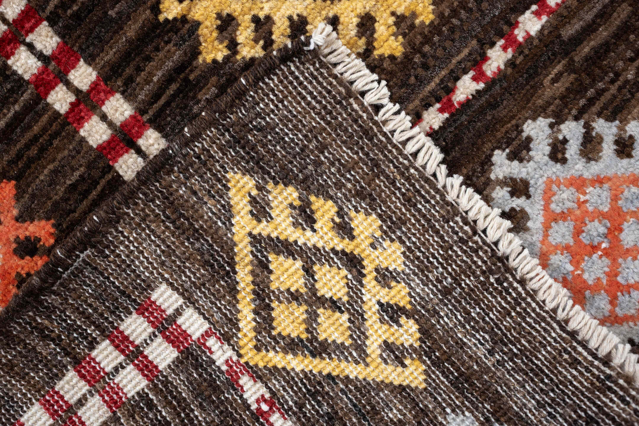 4' x 6' one-of-a-kind handmade vintage Jijim rug. Color palette: dark brown, ivory, coral, lavender, saffron, blue, sage