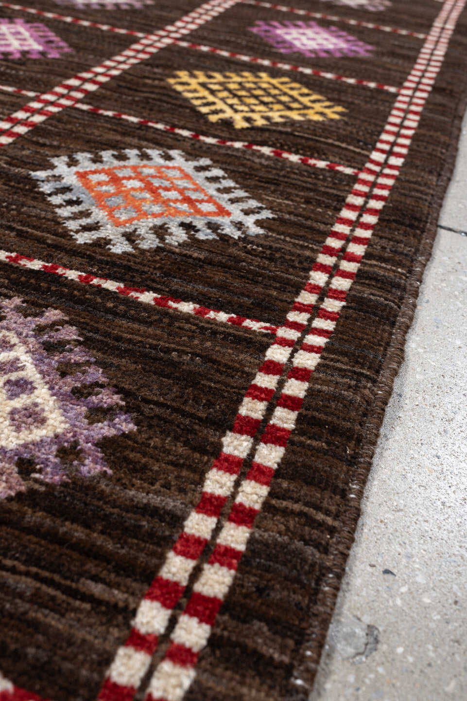 4' x 6' one-of-a-kind handmade vintage Jijim rug. Color palette: dark brown, ivory, coral, lavender, saffron, blue, sage