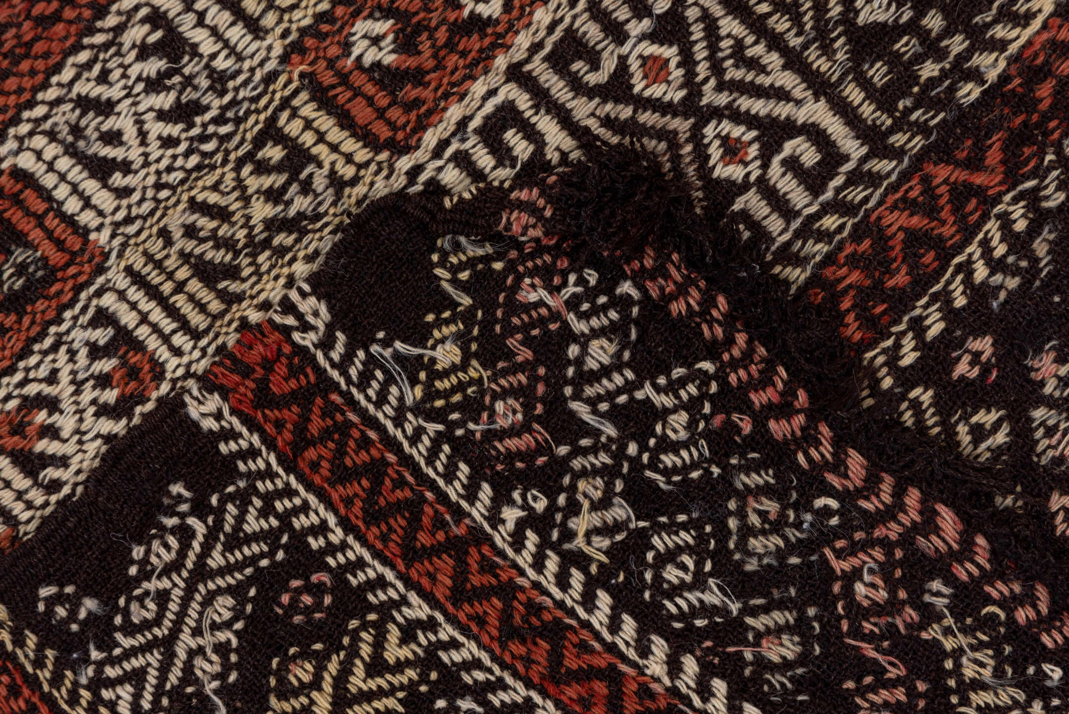 4' x 8' one-of-a-kind handmade vintage Jijim runner rug. Color palette: ivory, rust, charcoal, mahogany, brown, terracotta