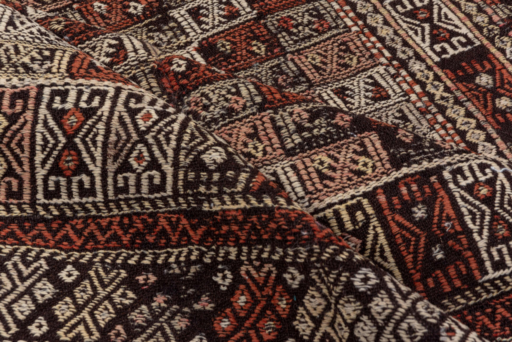 4' x 8' one-of-a-kind handmade vintage Jijim runner rug. Color palette: ivory, rust, charcoal, mahogany, brown, terracotta