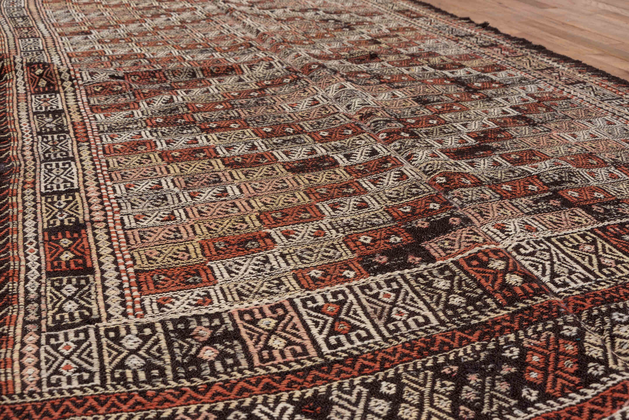 4' x 8' one-of-a-kind handmade vintage Jijim runner rug. Color palette: ivory, rust, charcoal, mahogany, brown, terracotta