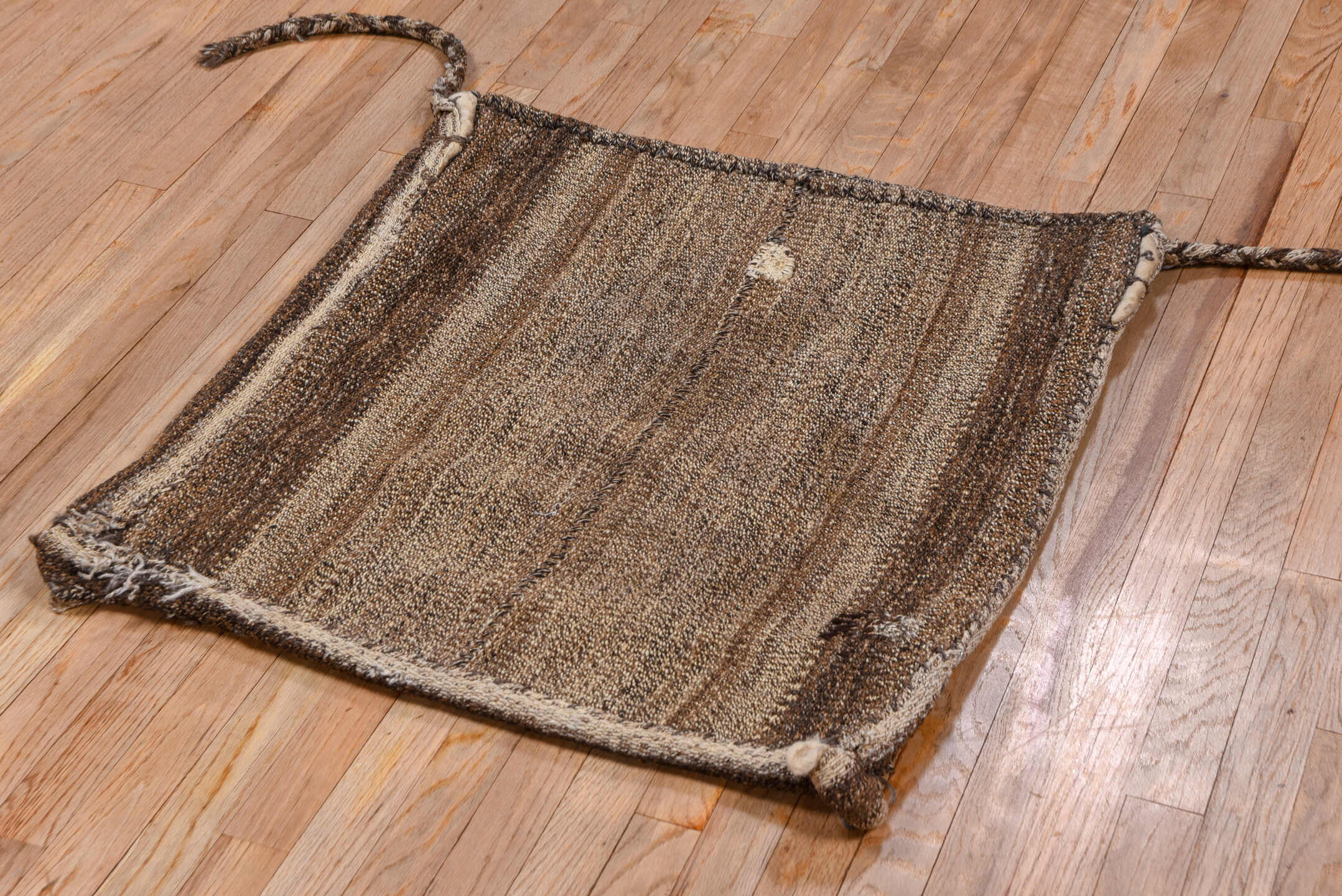 2' x 2' one-of-a-kind handmade vintage Grain Bag small size rug. Color palette: brown, taupe, camel, ivory, charcoal, beige