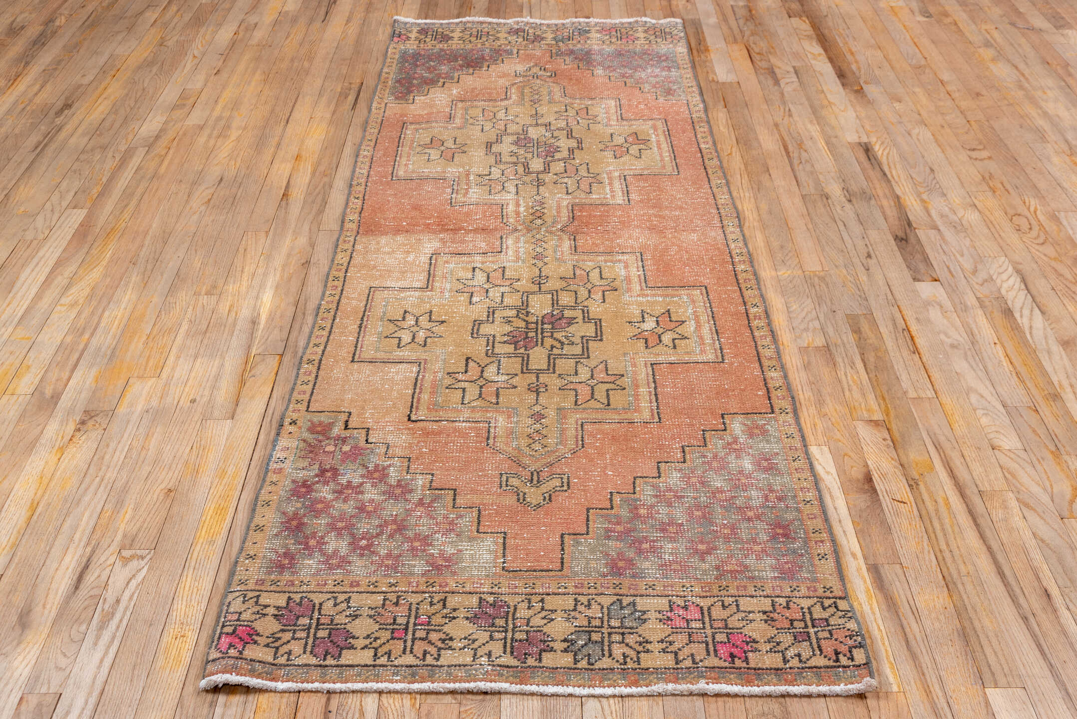 3' x 9' one-of-a-kind handmade vintage Oushak runner rug. Color palette: peach, camel, taupe, rose, burgundy, ivory, brown