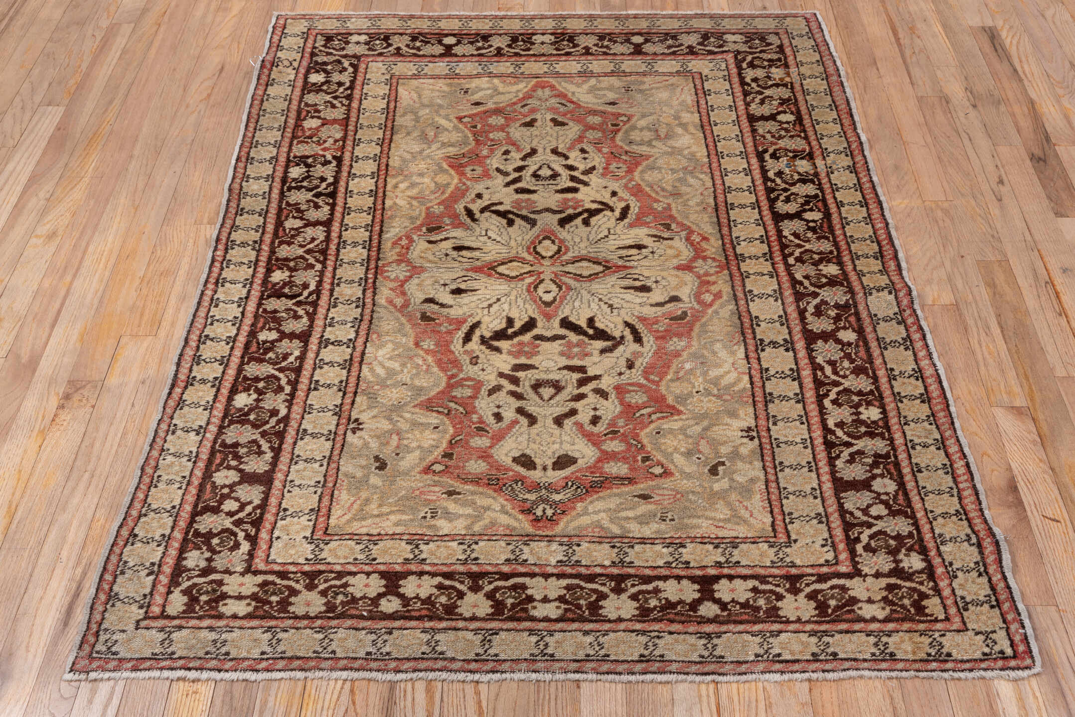 4' x 5' one-of-a-kind handmade vintage Oushak small size rug. Color palette: brown, gray, light gray, pink, red, redwood