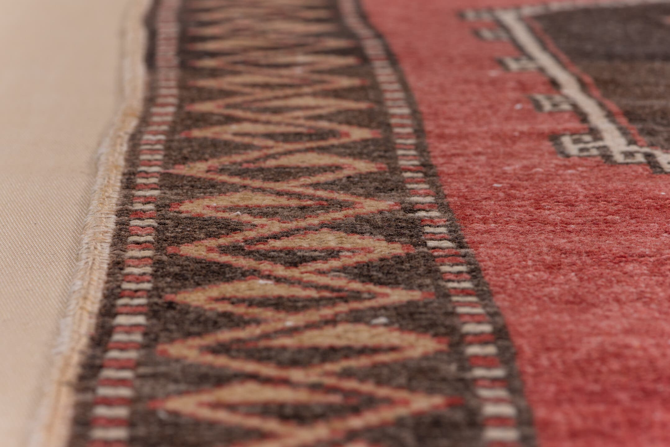 4' x 11' one-of-a-kind handmade vintage Oushak runner rug. Color palette: rust, charcoal, ivory, rose, burgundy, taupe
