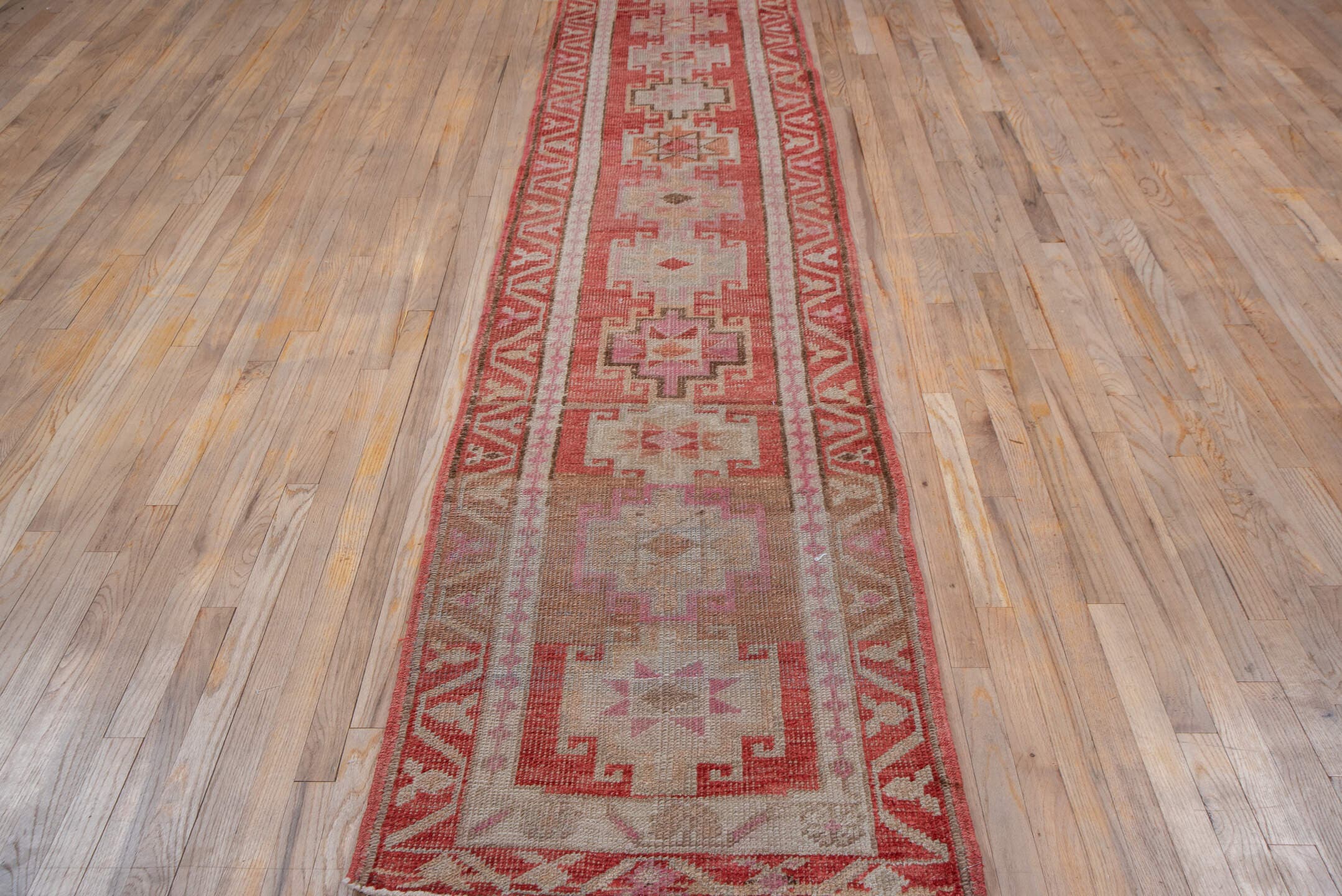 2' x 12' one-of-a-kind handmade vintage Oushak runner rug. Color palette: rose, ivory, blush, terra cotta, taupe, camel