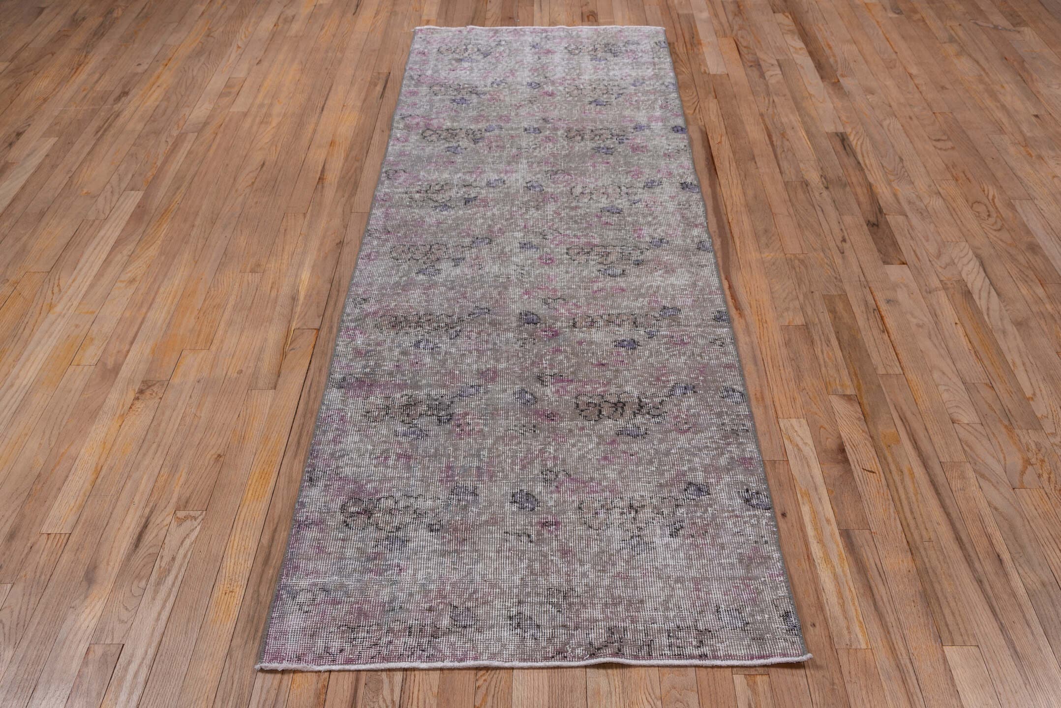 2' x 8' one-of-a-kind handmade vintage Overdyed runner rug. Color palette: taupe, ivory, rose, lavender, charcoal, beige