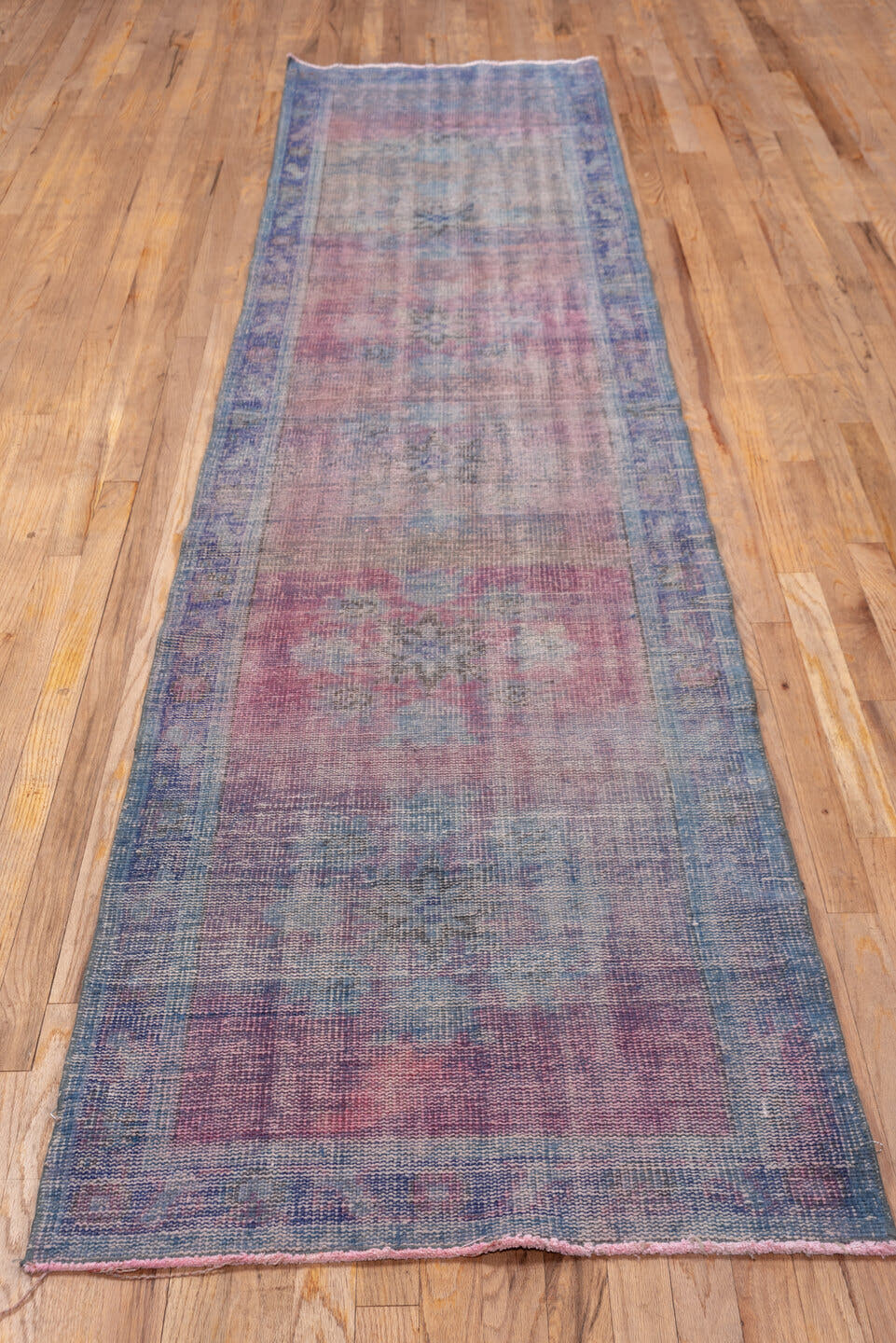 2' x 11' one-of-a-kind handmade vintage Overdyed runner rug. Color palette: rose, lavender, dusty blue, mauve, taupe, slate