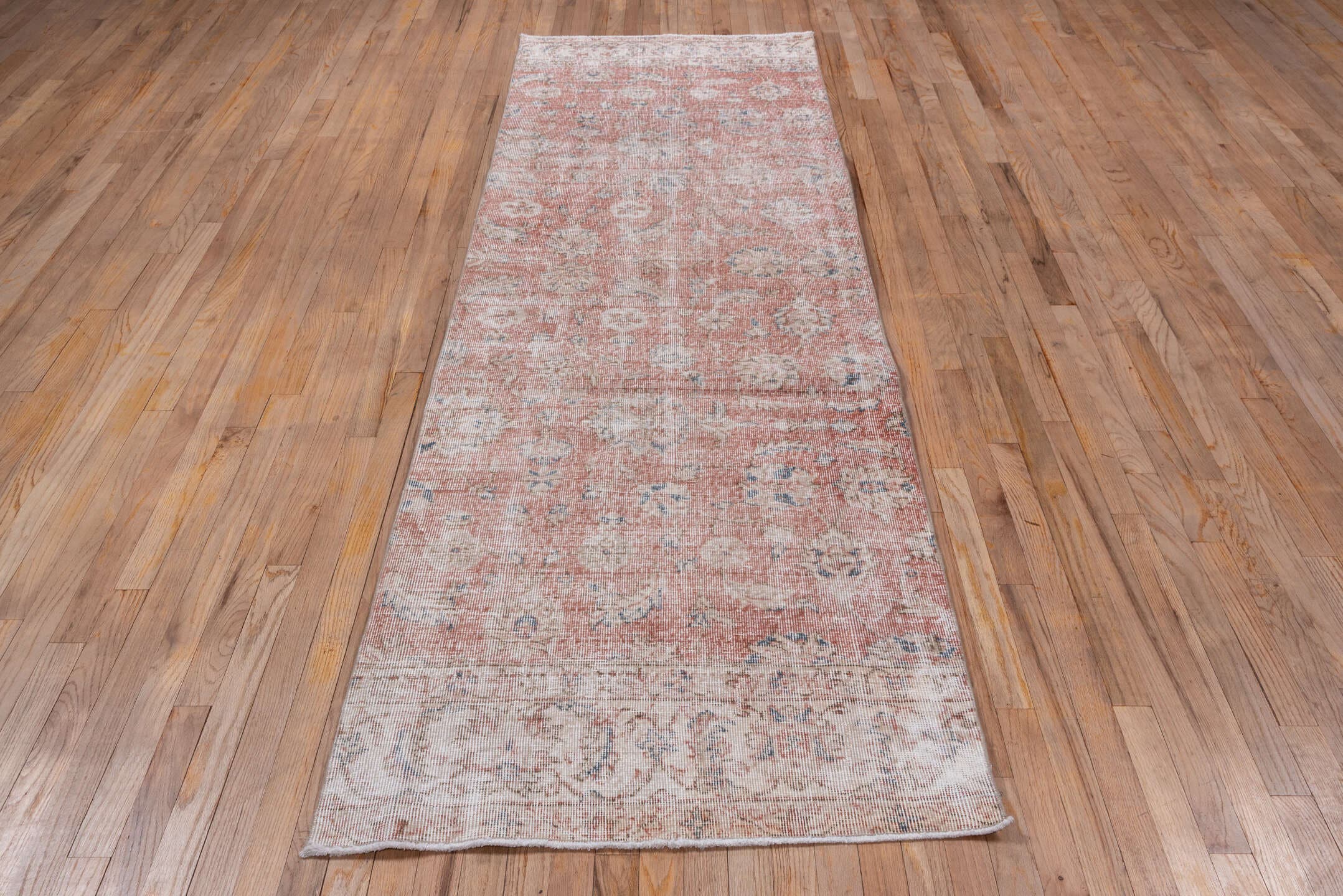 3' x 10' one-of-a-kind handmade vintage Oushak runner rug. Color palette: blush, ivory, dusty rose, pale blue, taupe, beige