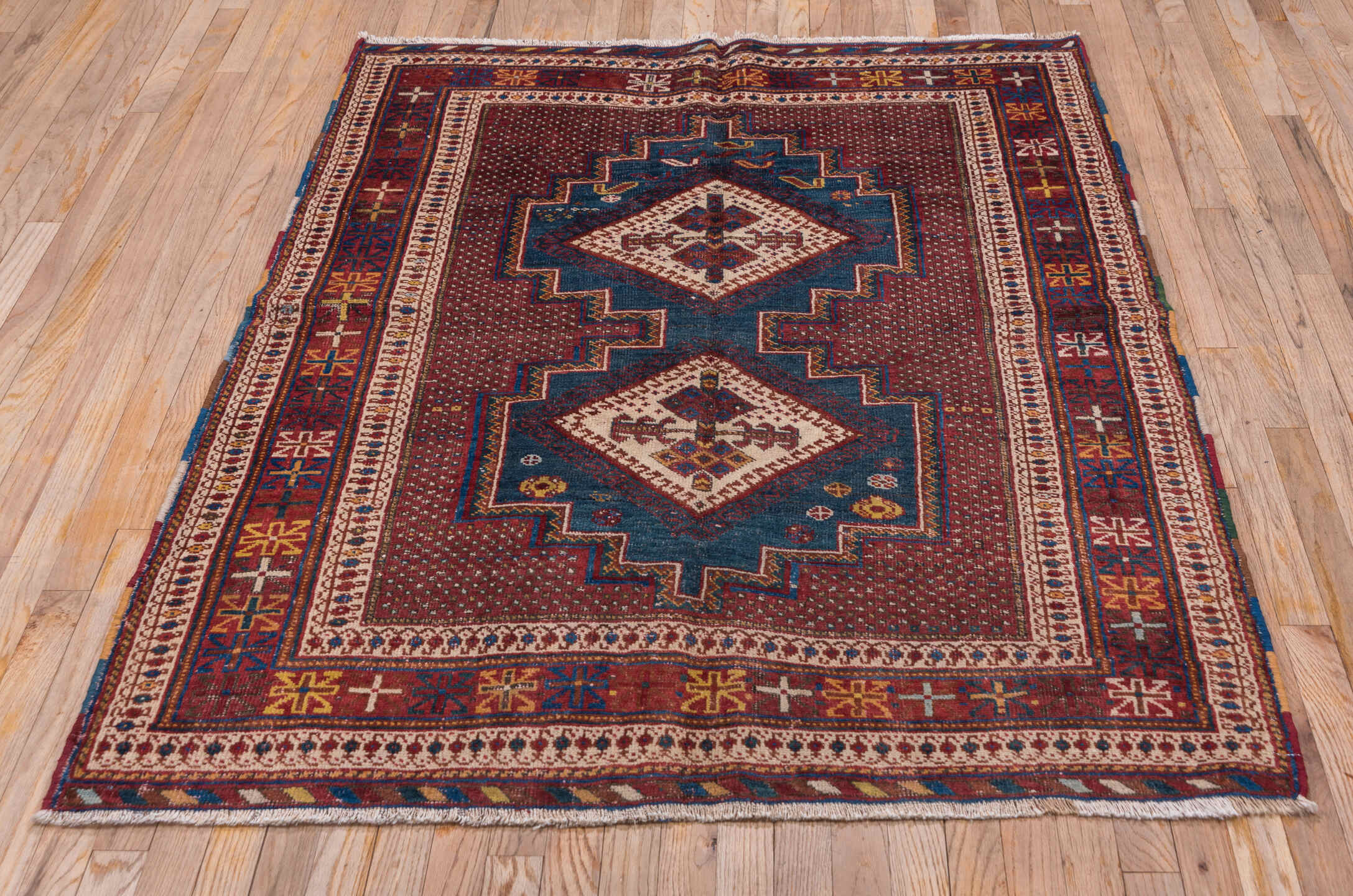 4' x 5' one-of-a-kind handmade antique Afshar small size rug. Color palette: rust, indigo, ivory, burgundy, camel, gold