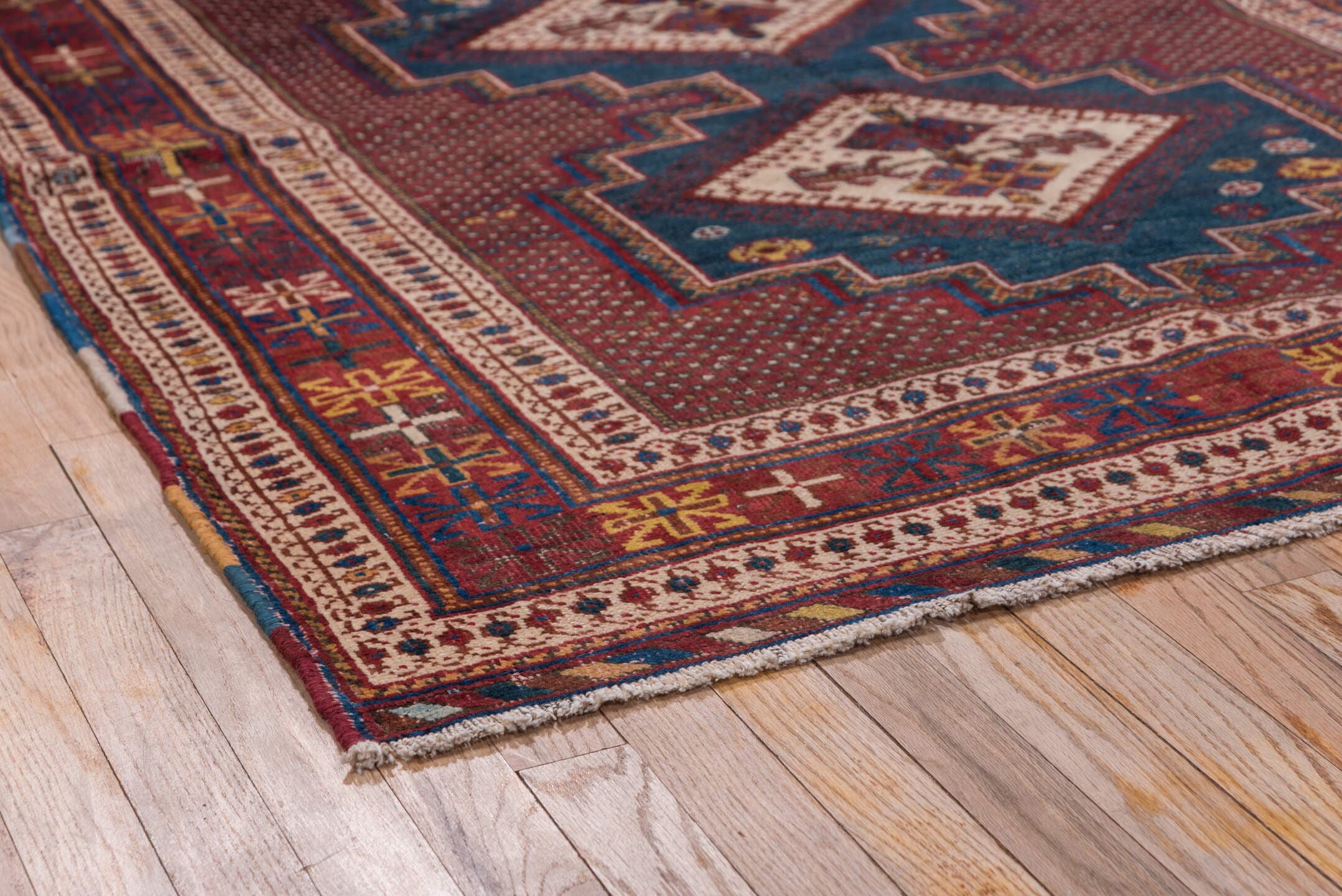 4' x 5' one-of-a-kind handmade antique Afshar small size rug. Color palette: rust, indigo, ivory, burgundy, camel, gold