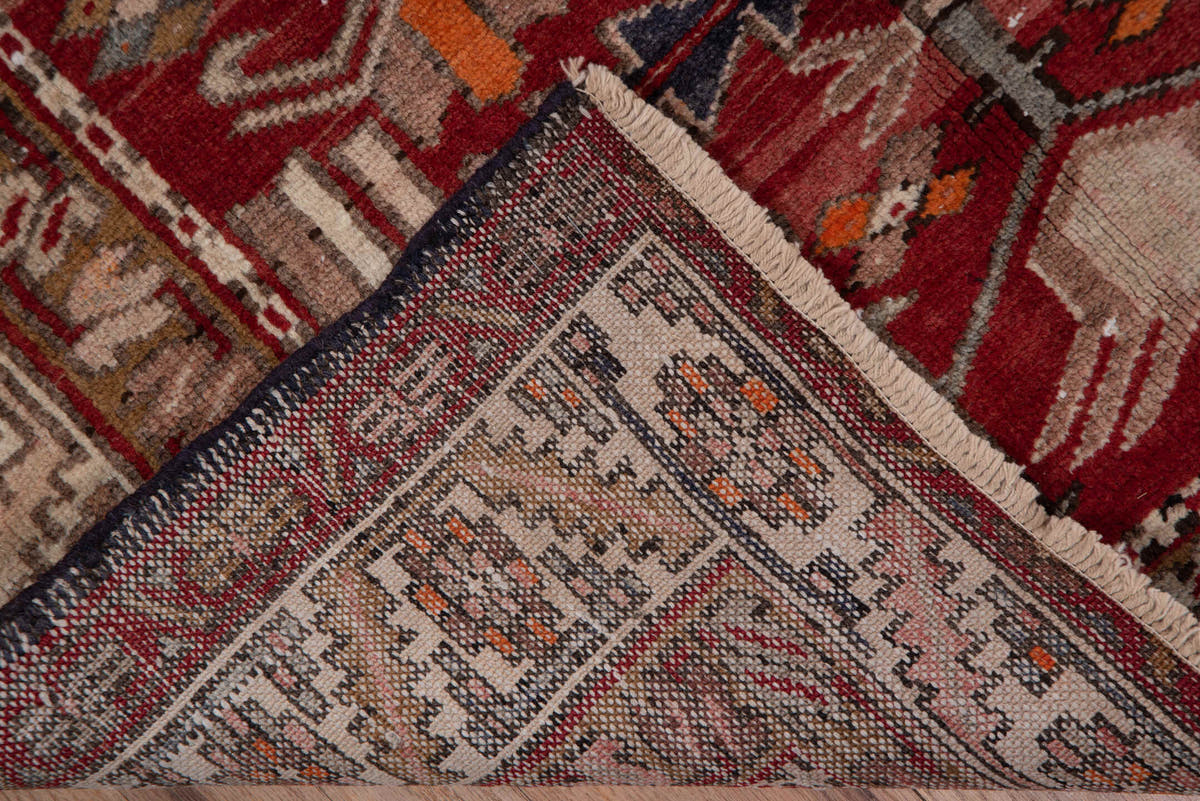 3' x 10' one-of-a-kind handmade vintage Heriz runner rug. Color palette: brick red, ivory, rose, rust, taupe, navy, orange