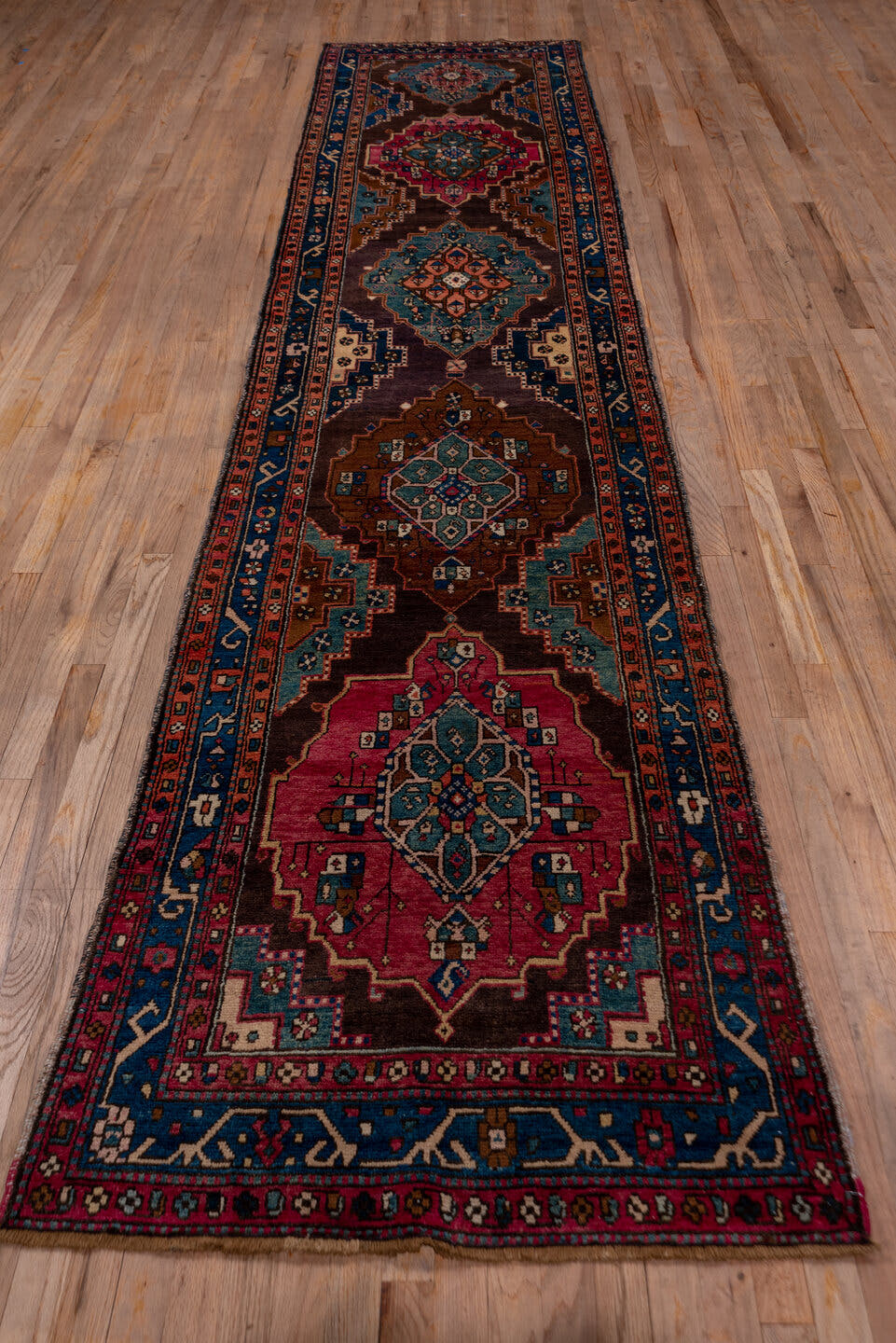 3' x 13' one-of-a-kind handmade antique Karabagh runner rug. Color palette: indigo, rose, aubergine, sky_blue, rust, ivory