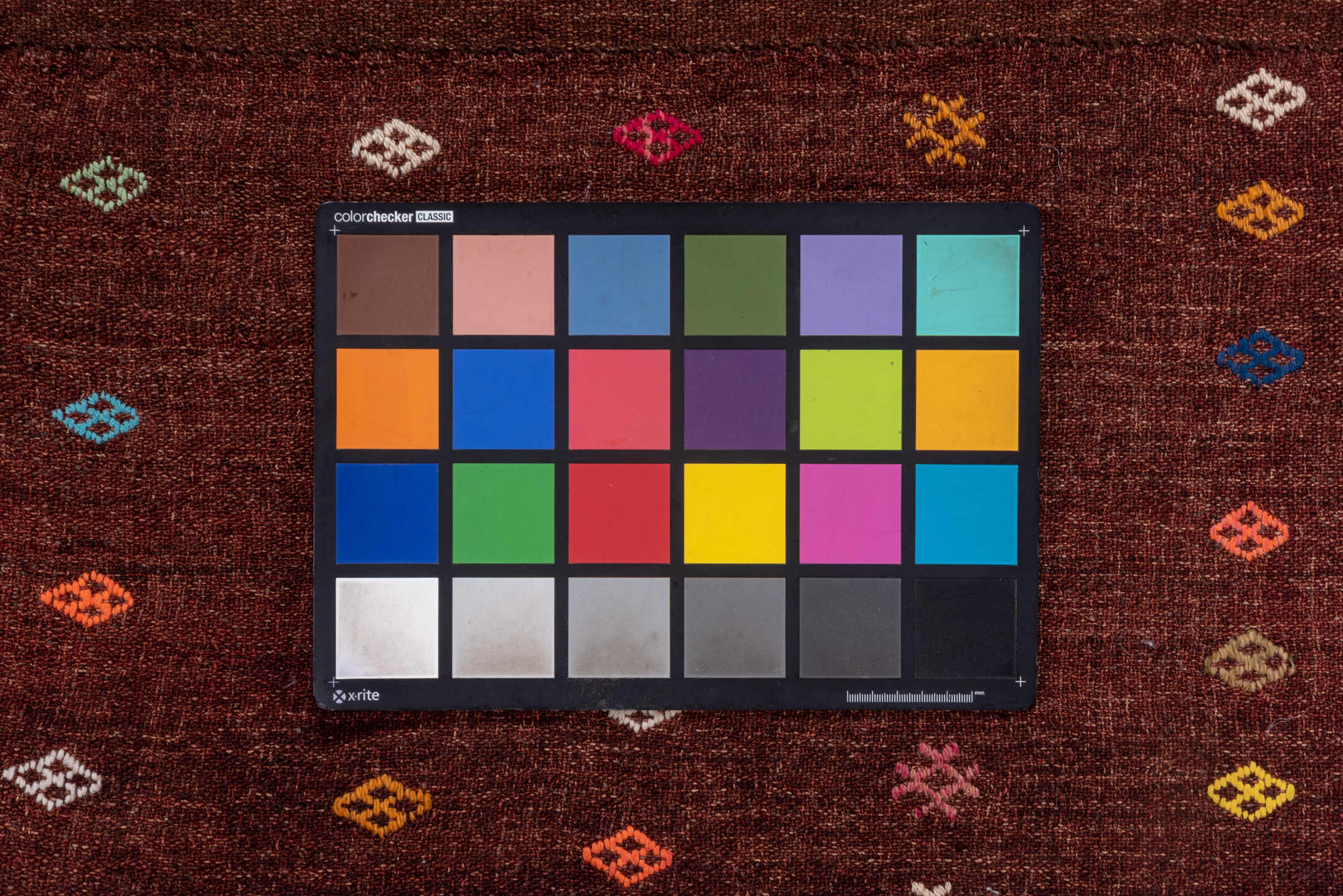 2' x 3' one-of-a-kind handmade vintage Jijim small size rug. Color palette: mahogany, rust, ivory, sky_blue, gold, coral