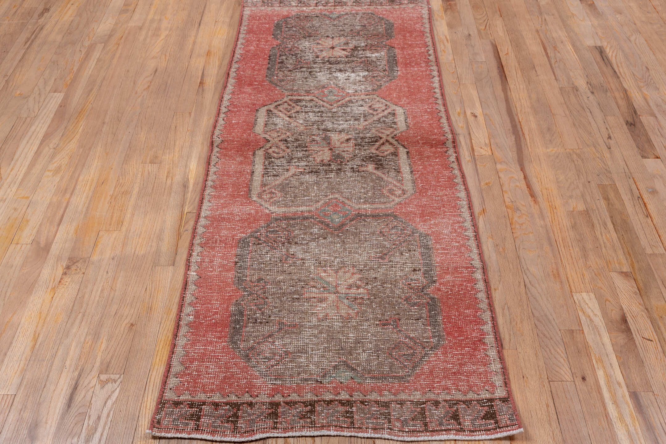 2' x 7' one-of-a-kind handmade vintage Oushak runner rug. Color palette: brown, gray, light gray, off-white, pink, red