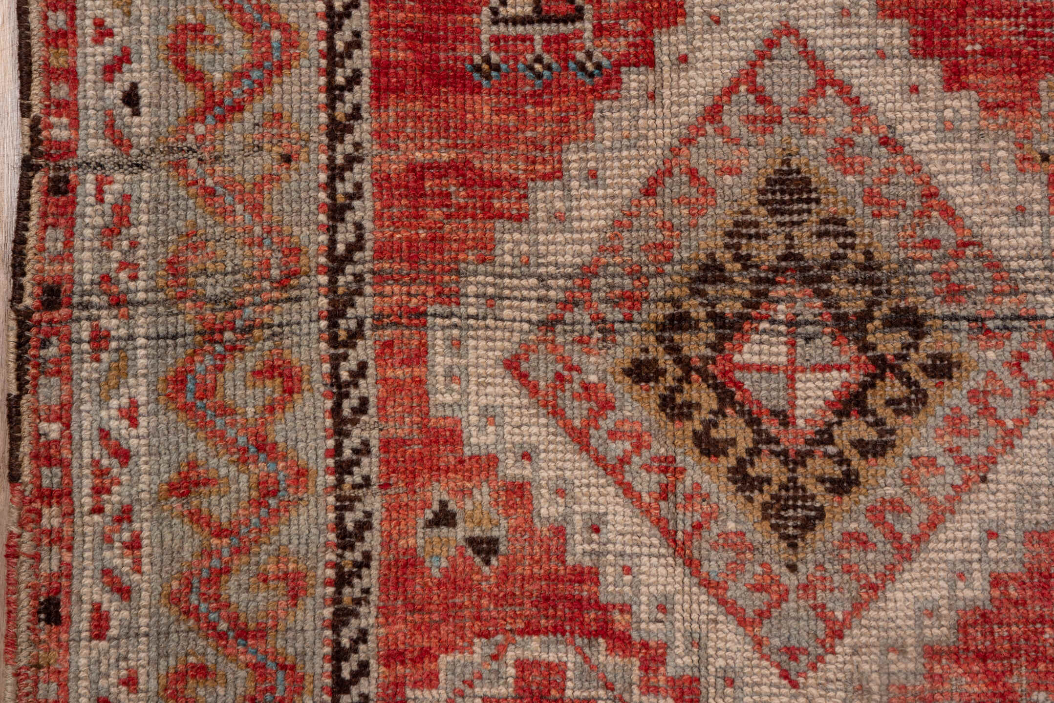 4' x 11' one-of-a-kind handmade vintage Oushak runner rug. Color palette: coral, ivory, taupe, slate, rust, charcoal, rose