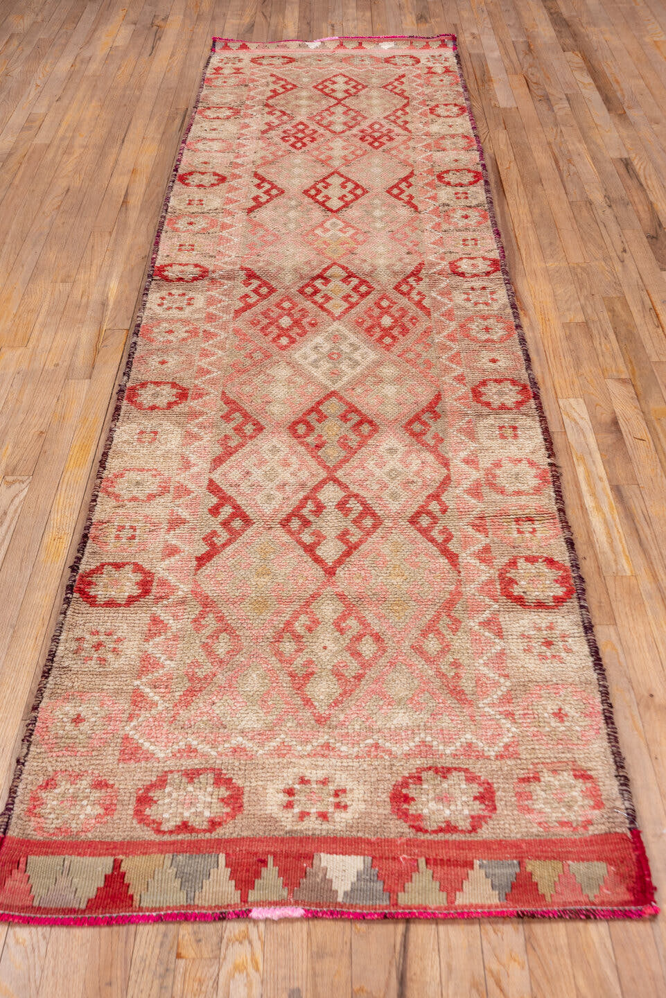 3' x 11' one-of-a-kind handmade vintage Oushak runner rug. Color palette: blush, ivory, coral, rose, taupe, camel, pink