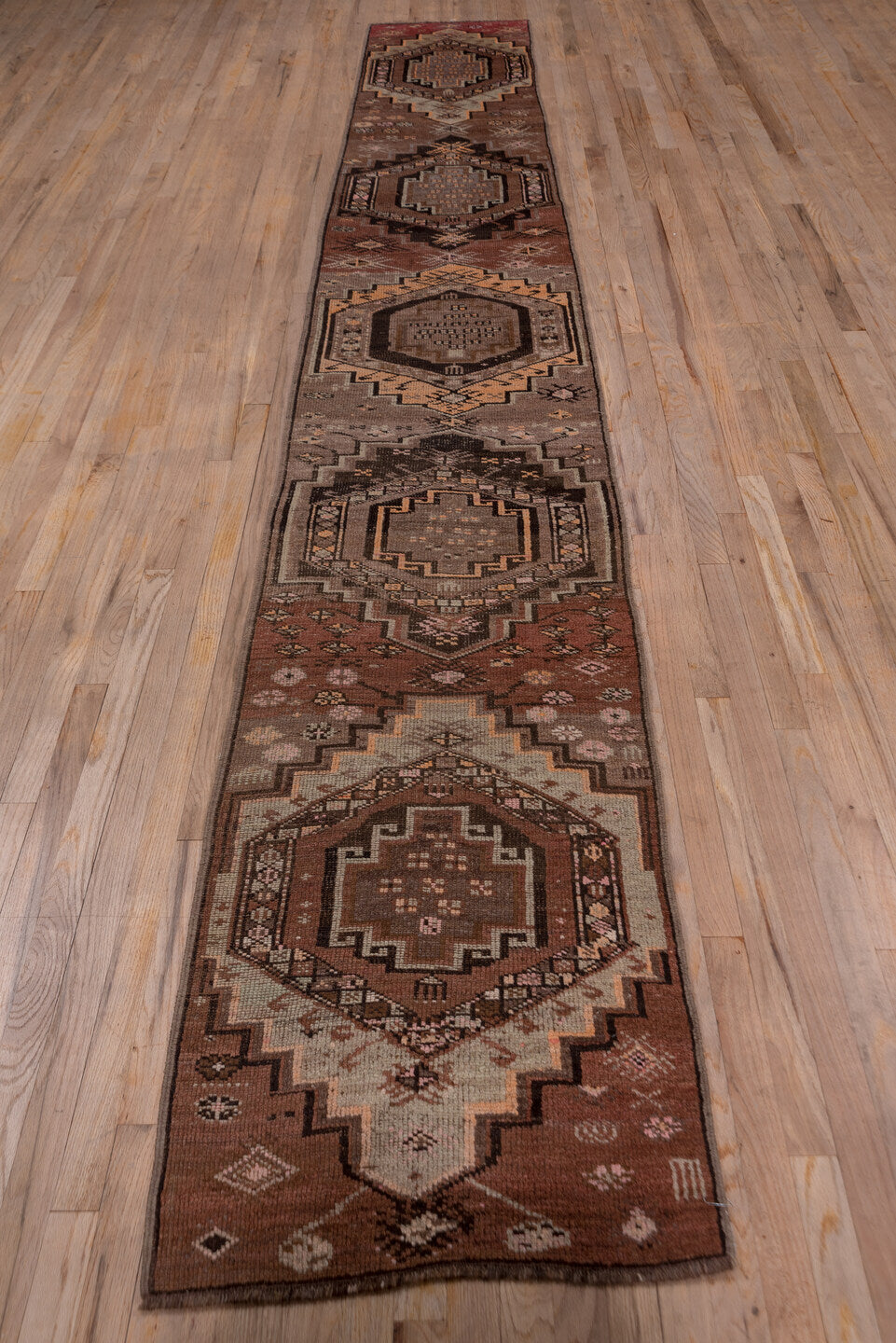 2' x 14' one-of-a-kind handmade vintage Kars runner rug. Color palette: brown, gray, off-white, pink, redwood, snow, white