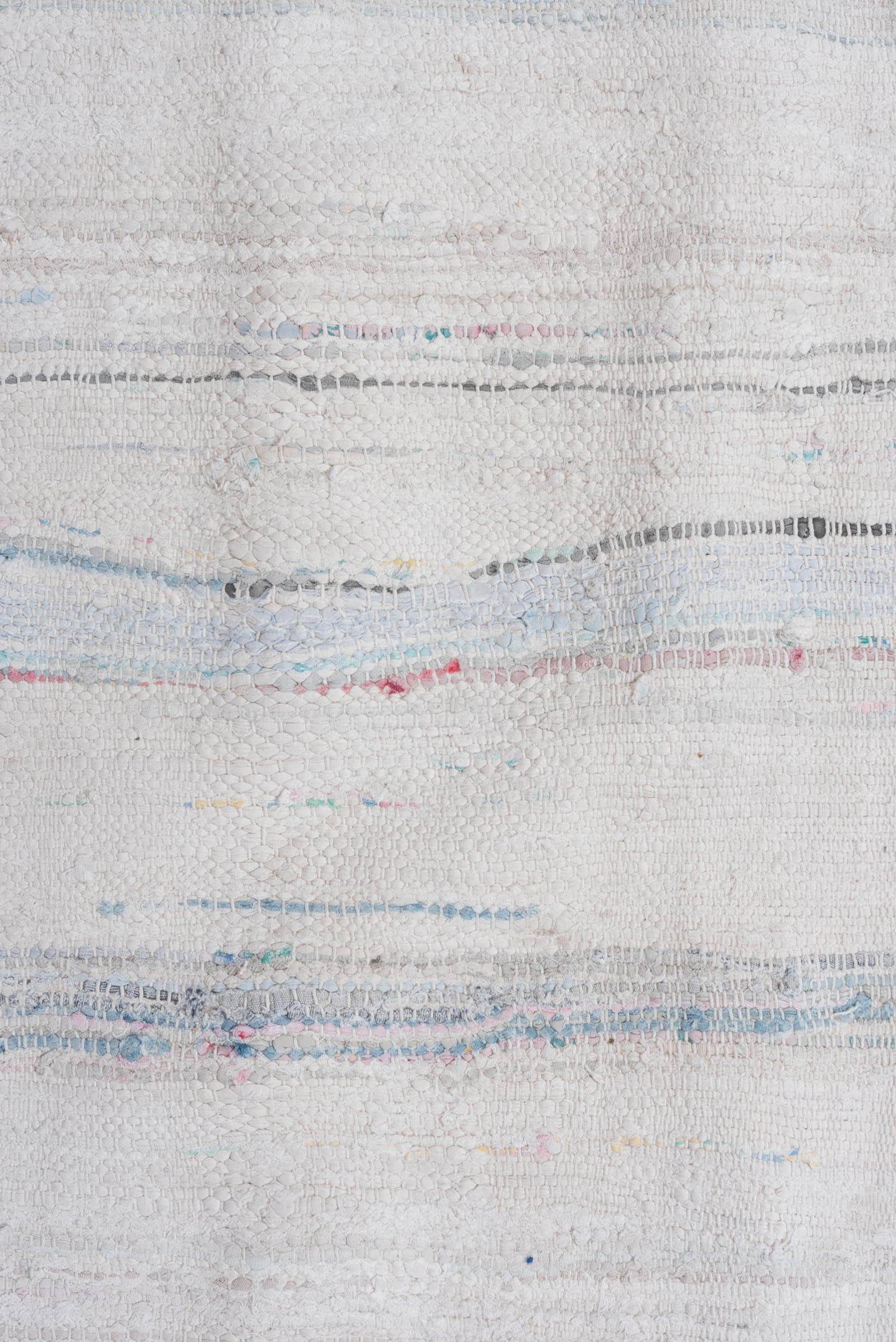 5' x 10' one-of-a-kind handmade vintage Rag Rug medium size rug. Color palette: ivory, pale blue, sky blue, charcoal, blush