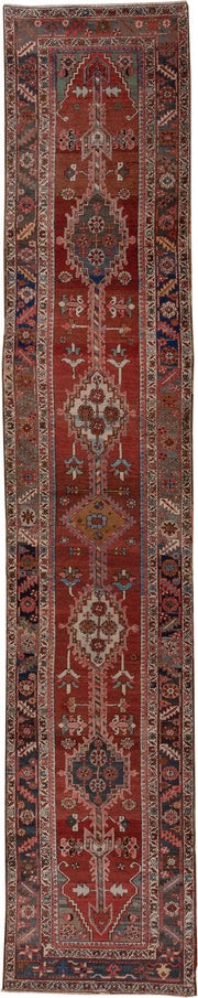 3' x 15' one-of-a-kind handmade antique Serapi runner rug. Color palette: rust, indigo, ivory, slate, rose, camel, navy
