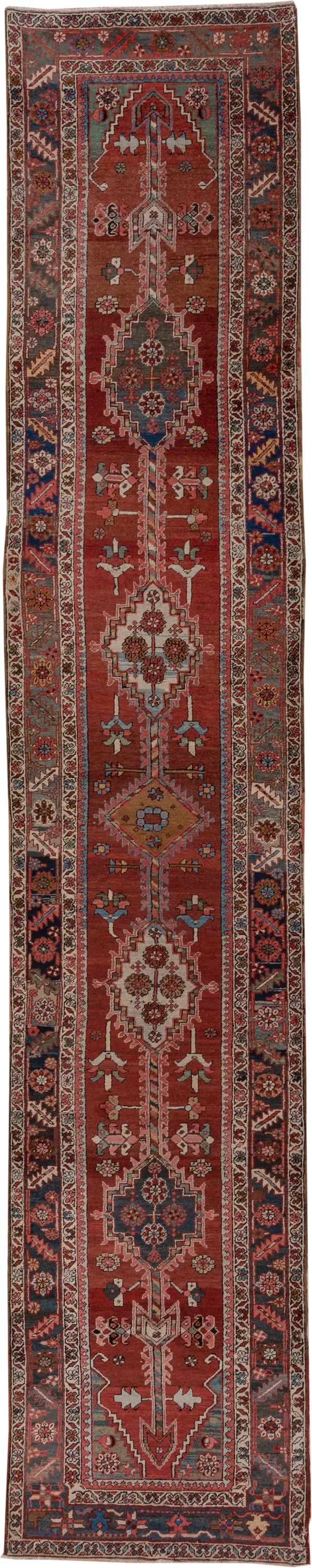 3' x 15' one-of-a-kind handmade antique Serapi runner rug. Color palette: rust, indigo, ivory, slate, rose, camel, navy