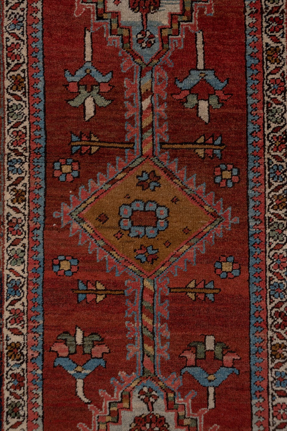 3' x 15' one-of-a-kind handmade antique Serapi runner rug. Color palette: rust, indigo, ivory, slate, rose, camel, navy