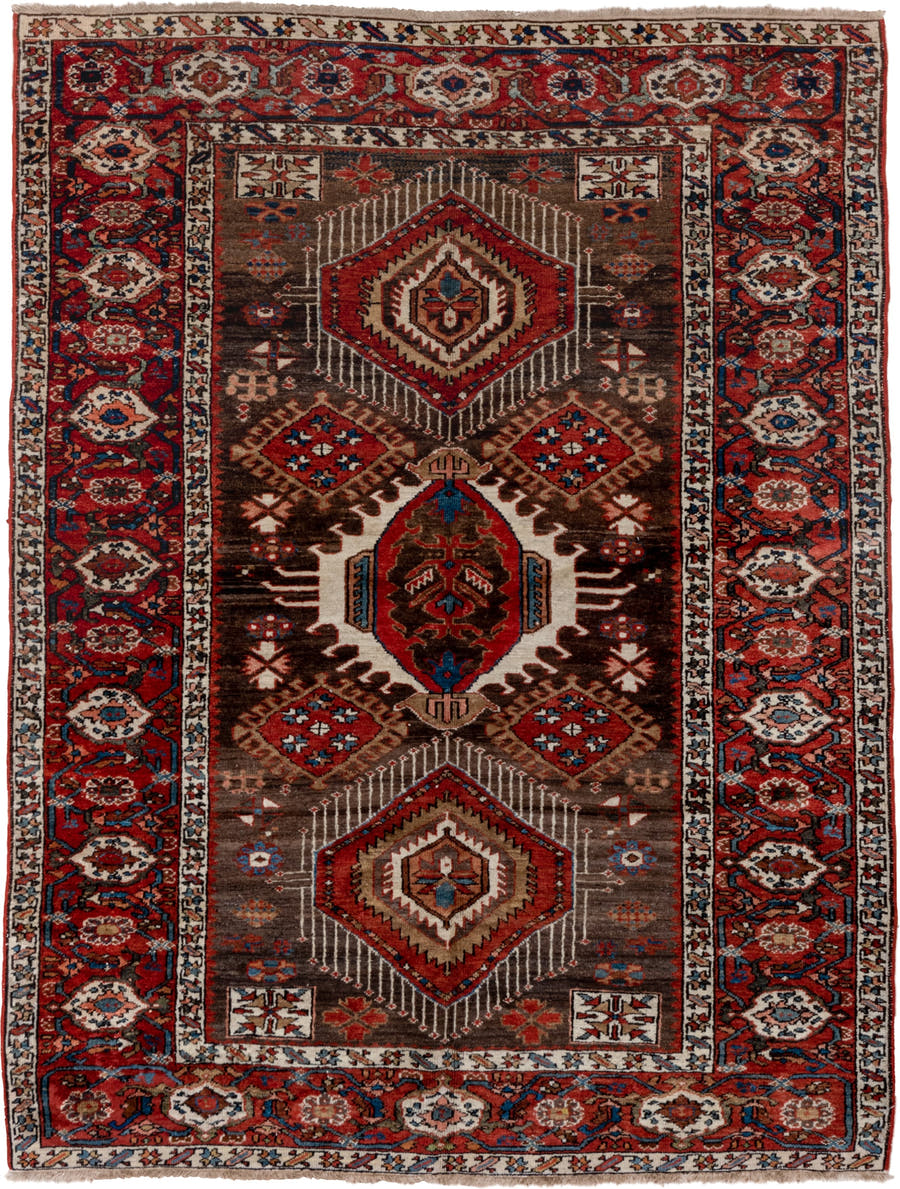 5' x 6' one-of-a-kind handmade antique Karaje rug. Color palette: rust, brown, ivory, indigo, navy, camel, crimson, taupe