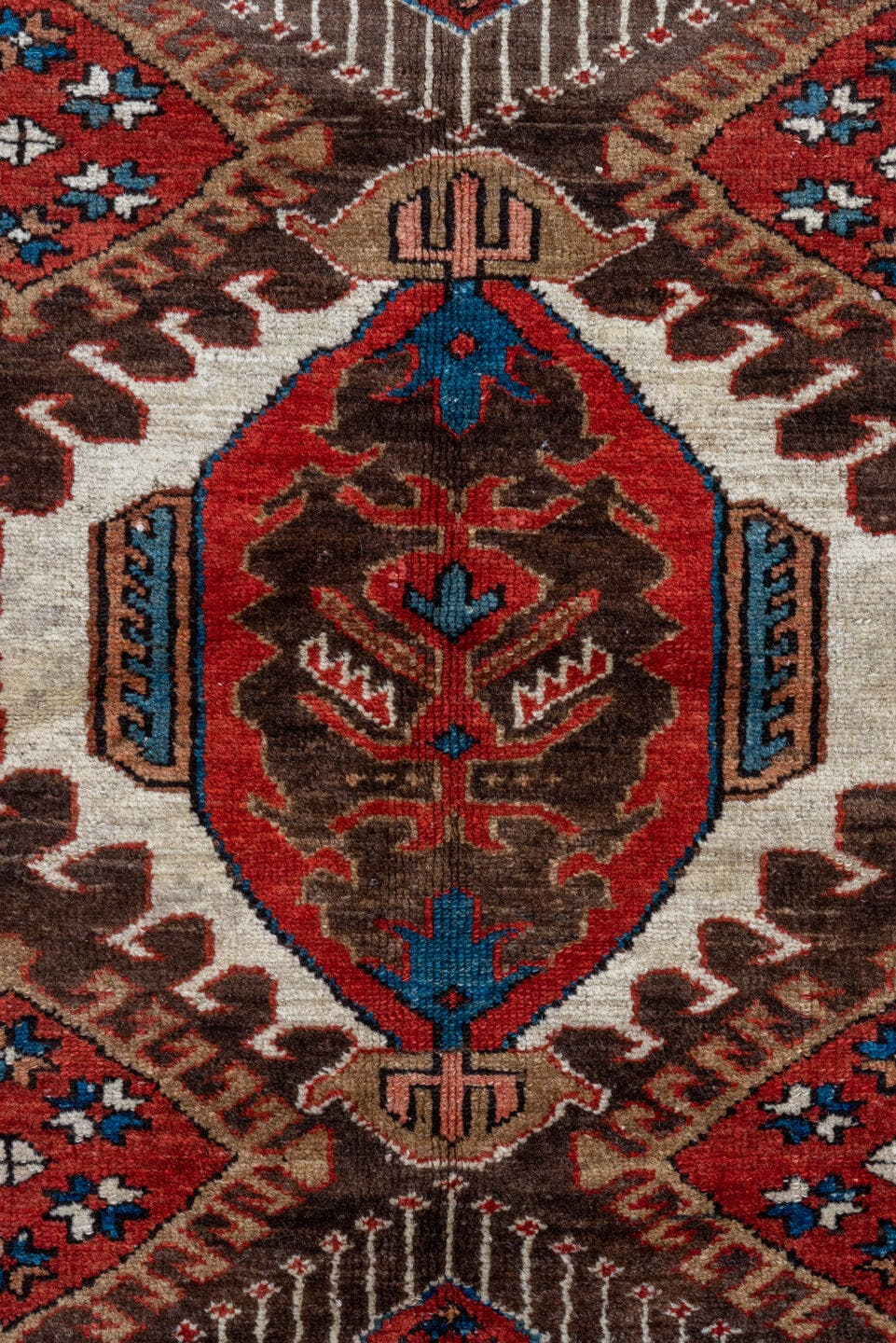5' x 6' one-of-a-kind handmade antique Karaje rug. Color palette: rust, brown, ivory, indigo, navy, camel, crimson, taupe