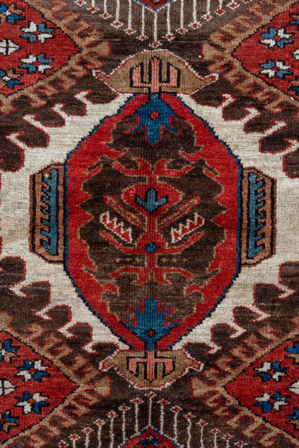 5' x 6' one-of-a-kind handmade antique Karaje rug. Color palette: rust, brown, ivory, indigo, navy, camel, crimson, taupe